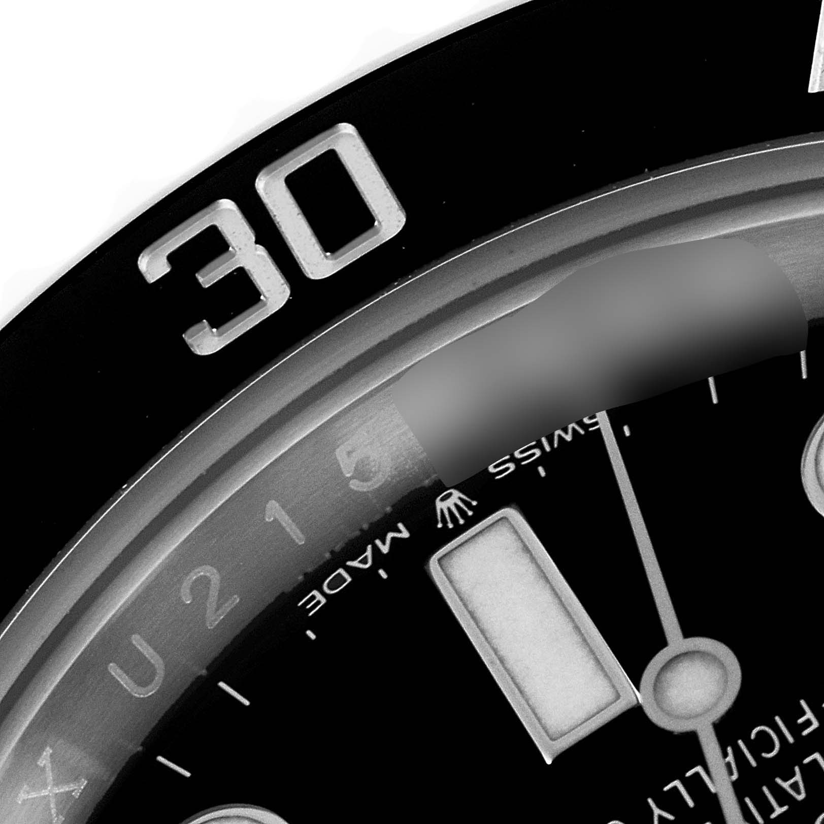 This close-up image shows the bezel and part of the dial of a Rolex Submariner 124060 Men
s Stainless Steel Black Dial 124060 Men
s Stainless Steel Black Dial, highlighting the 
30
 mark and some indices.