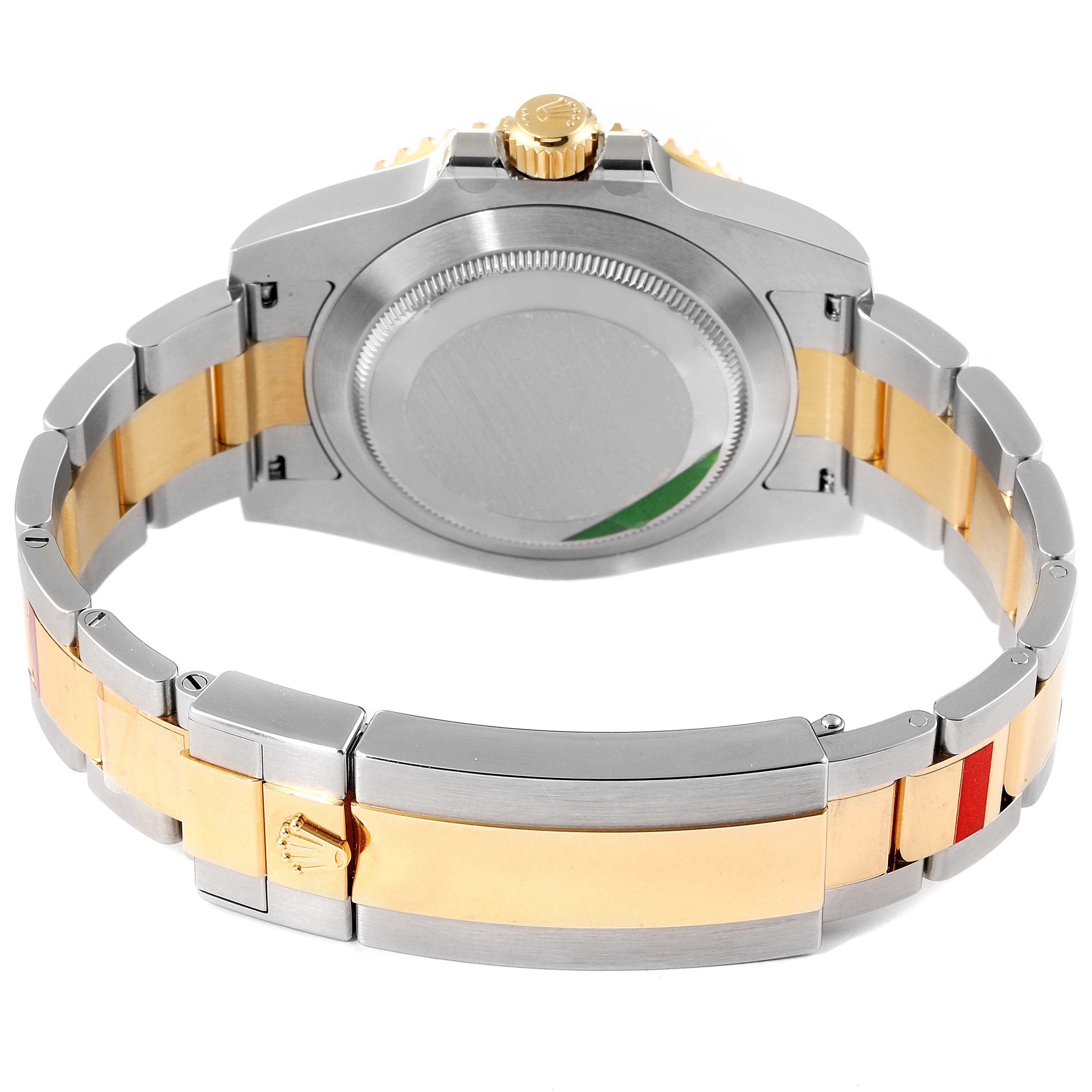 The image shows the back view of a Rolex Submariner 116613 Men
s Steel and Gold (two tone) Blue Dial 116613 Men
s Steel and Gold (two tone) Blue Dial watch, highlighting the case back and two-tone bracelet.