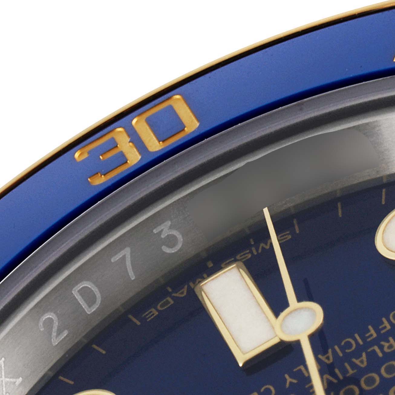 The image shows a close-up of the bezel and part of the dial of a Rolex Submariner 116613 Men
s Steel and Gold (two tone) Blue Dial 116613 Men
s Steel and Gold (two tone) Blue Dial watch.