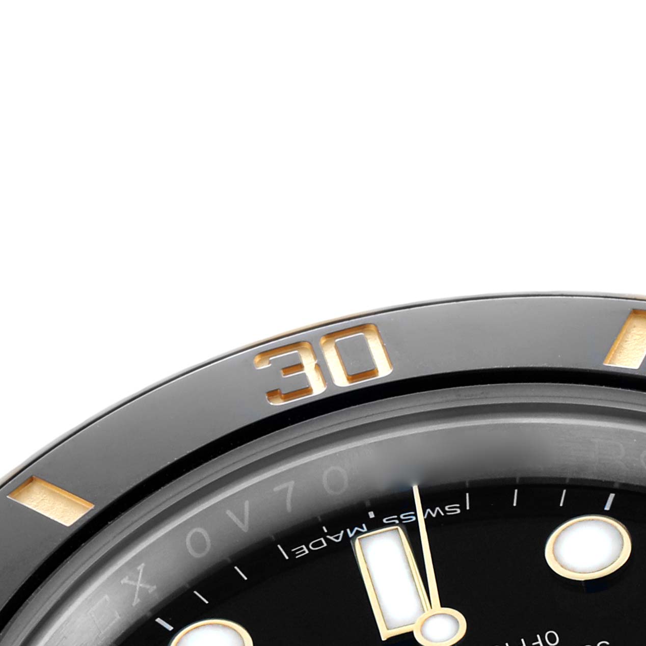 The image shows a close-up of the bezel and part of the dial of a Rolex Submariner 116613 Men
s Steel and Gold (two tone) Black Dial watch.