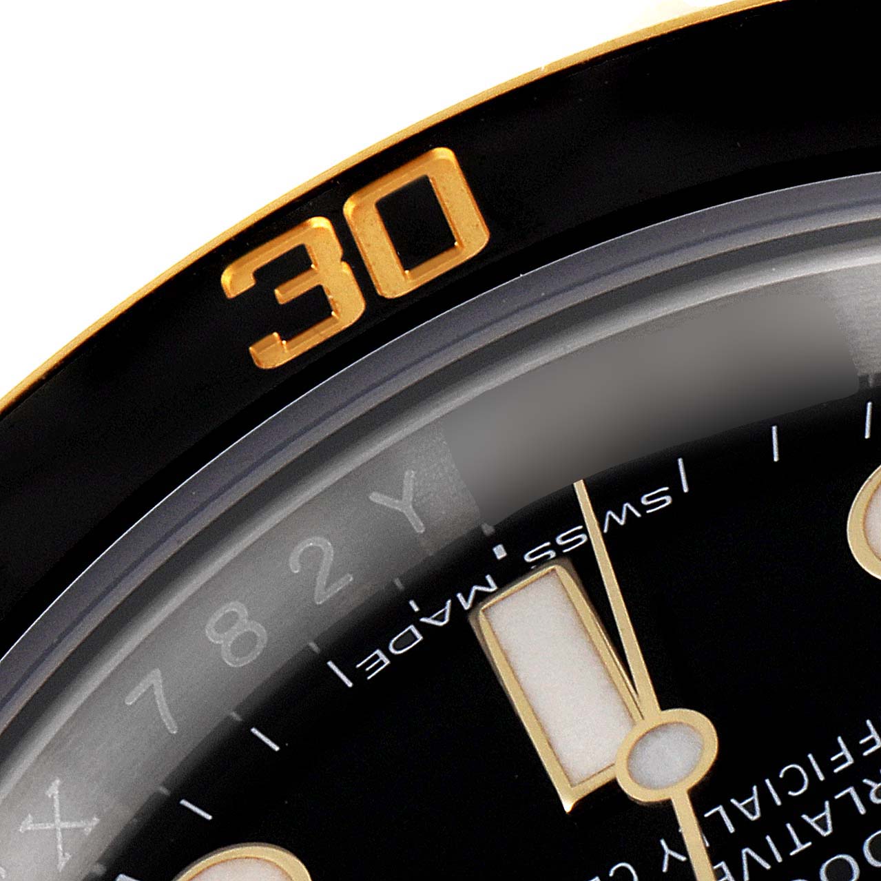 The image shows a close-up of the bezel and part of the dial of a Rolex Submariner 116613 Men's Steel and Gold (two tone) Black Dial 116613 Men's Steel and Gold (two tone) Black Dial watch, specifically highlighting the 30-minute marker.