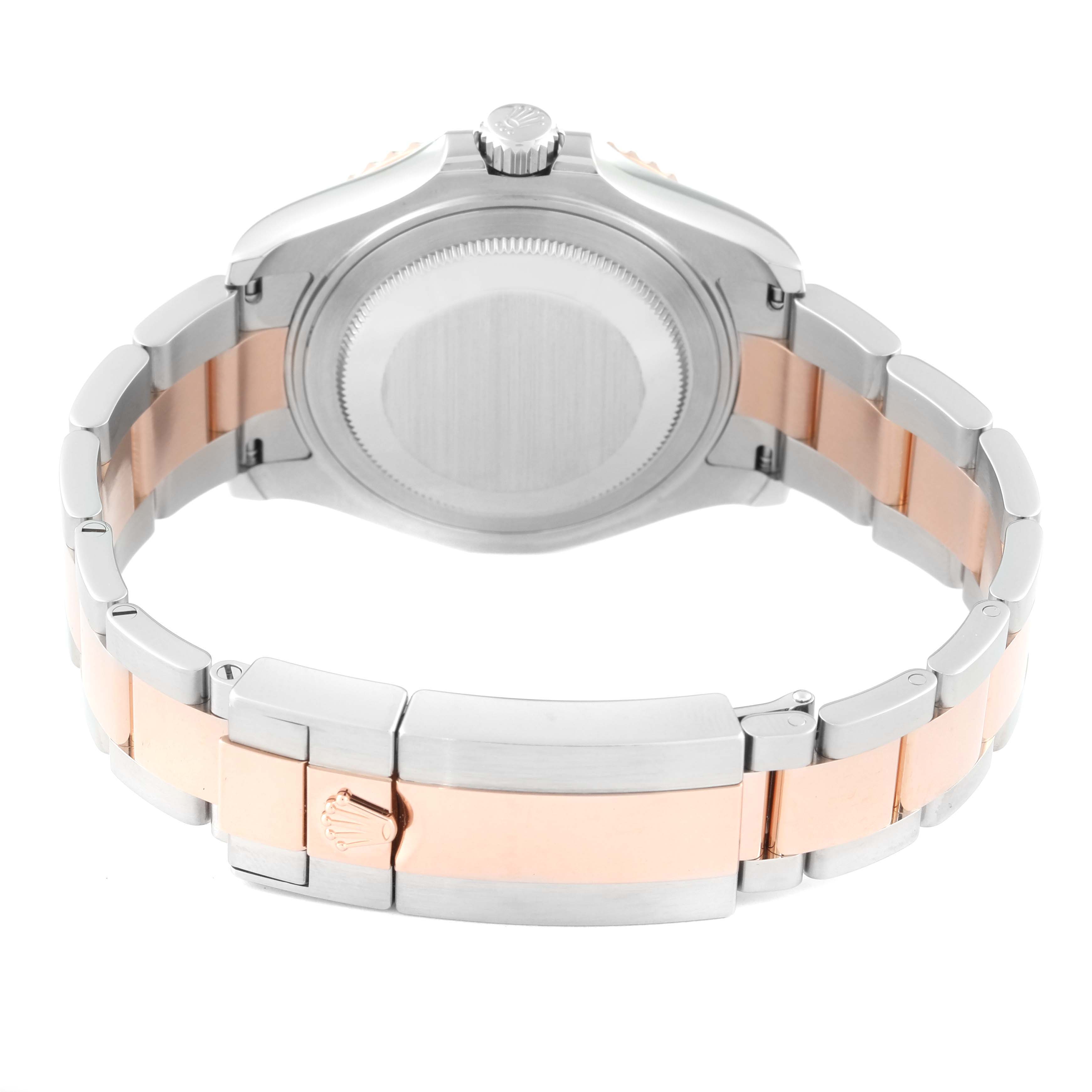 The Rolex Yacht-Master 268621 Men's Steel and Gold (two tone) Brown Dial 268621 Men's Steel and Gold (two tone) Brown Dial watch is shown from the back, highlighting the case back, bracelet, and clasp.