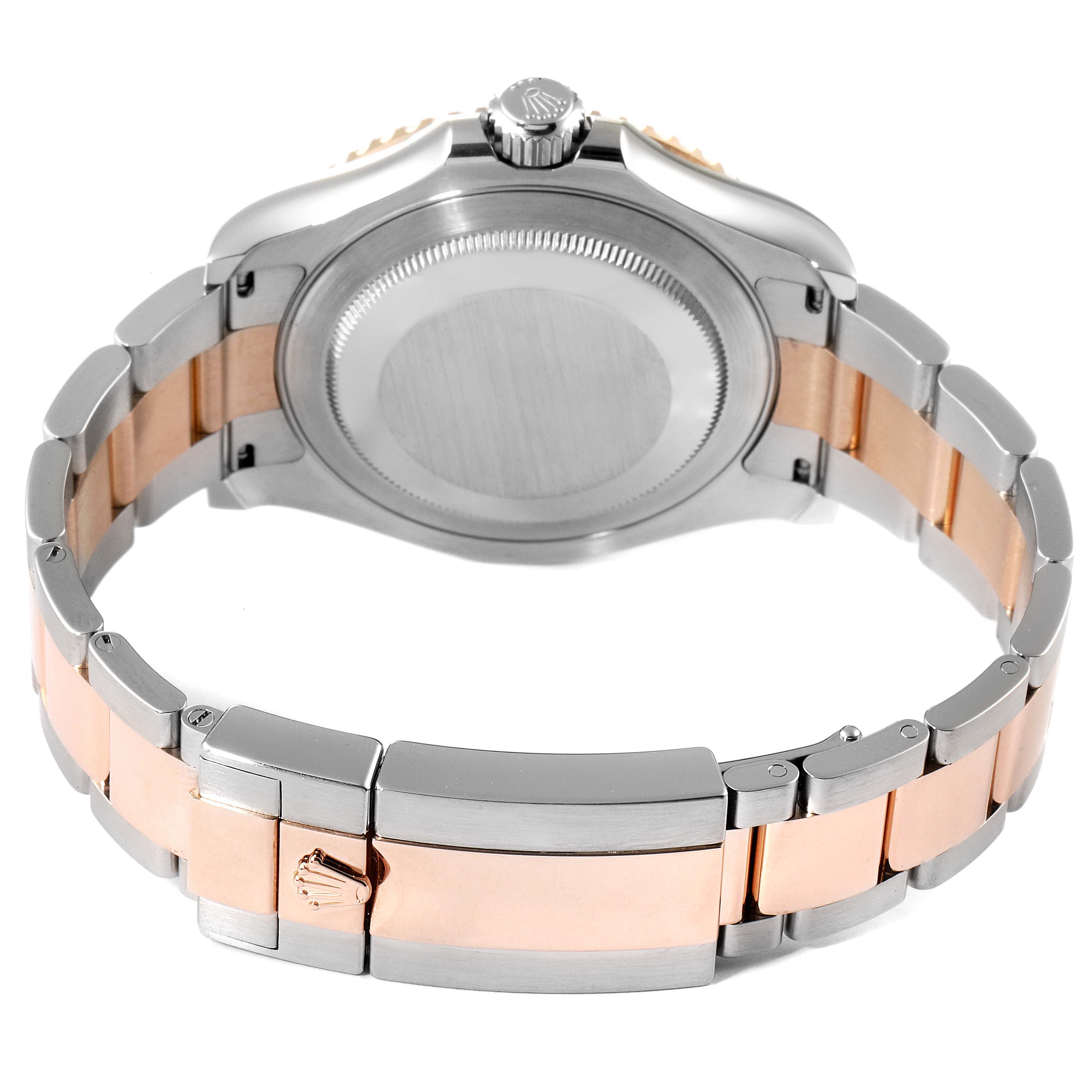 The image shows the back case and bracelet of a Rolex Yacht-Master 126621 Men
s Steel and Gold (two tone) Black Dial 126621 Men
s Steel and Gold (two tone) Black Dial watch from a slightly elevated rear angle.
