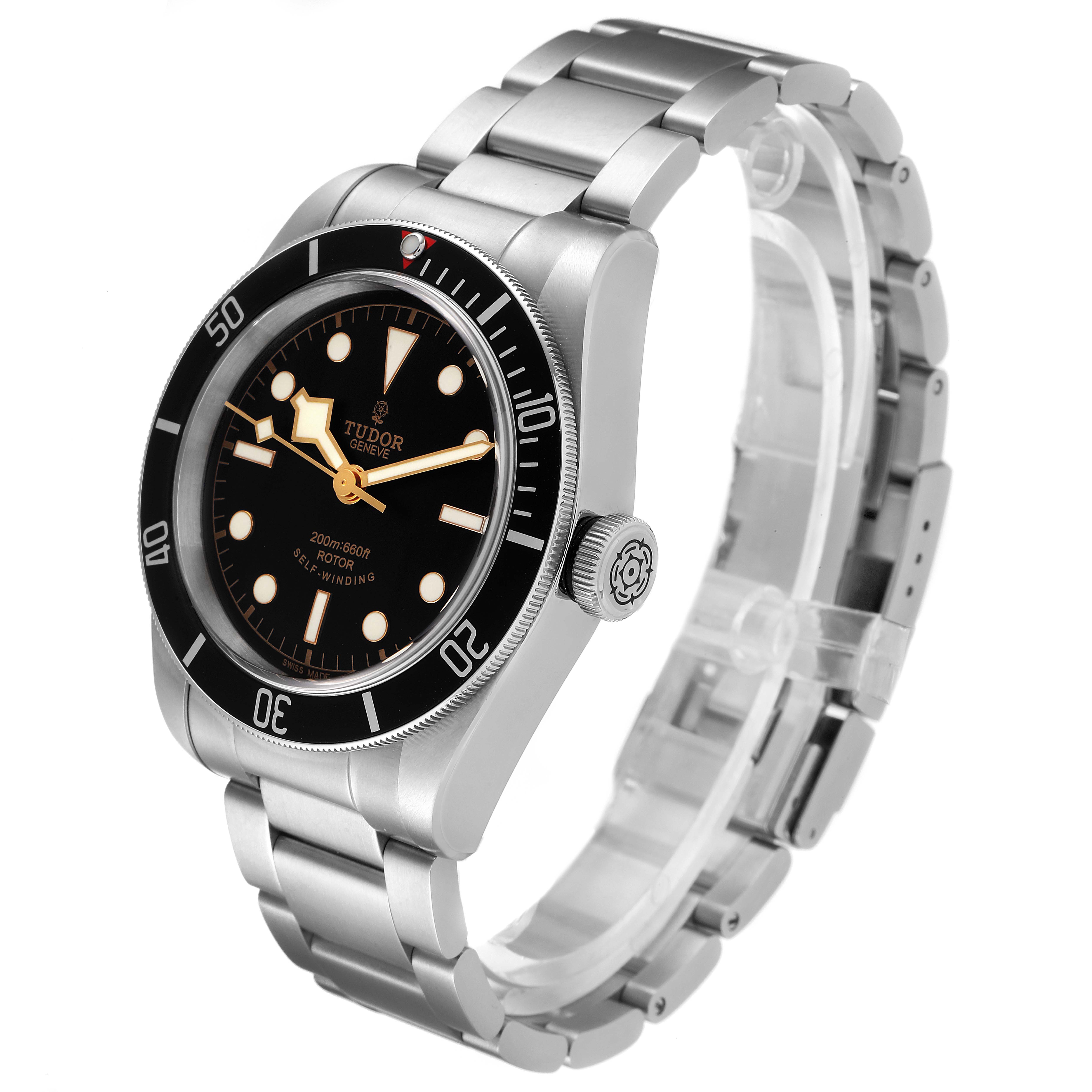 The image shows a Tudor Heritage Black Bay 79220 Men
s Stainless Steel Black Dial 79220 Men
s Stainless Steel Black Dial watch from a 3/4 angle, highlighting its dial, bezel, crown, and bracelet.