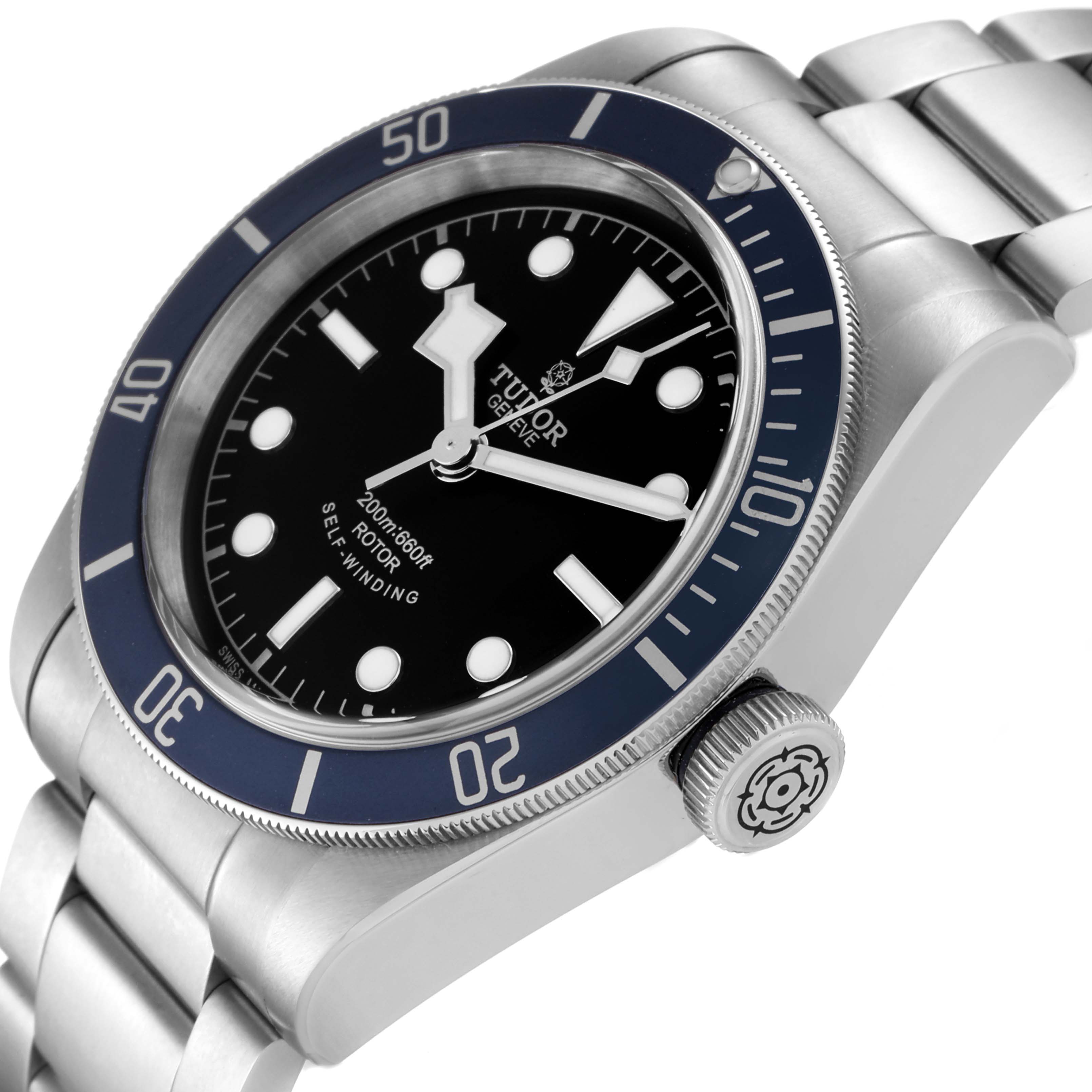 This image shows a close-up, angled view of the Tudor Heritage Black Bay 79220 Men's Stainless Steel Black Dial 79220 Men's Stainless Steel Black Dial watch, displaying its face, bezel, crown, and part of the bracelet.