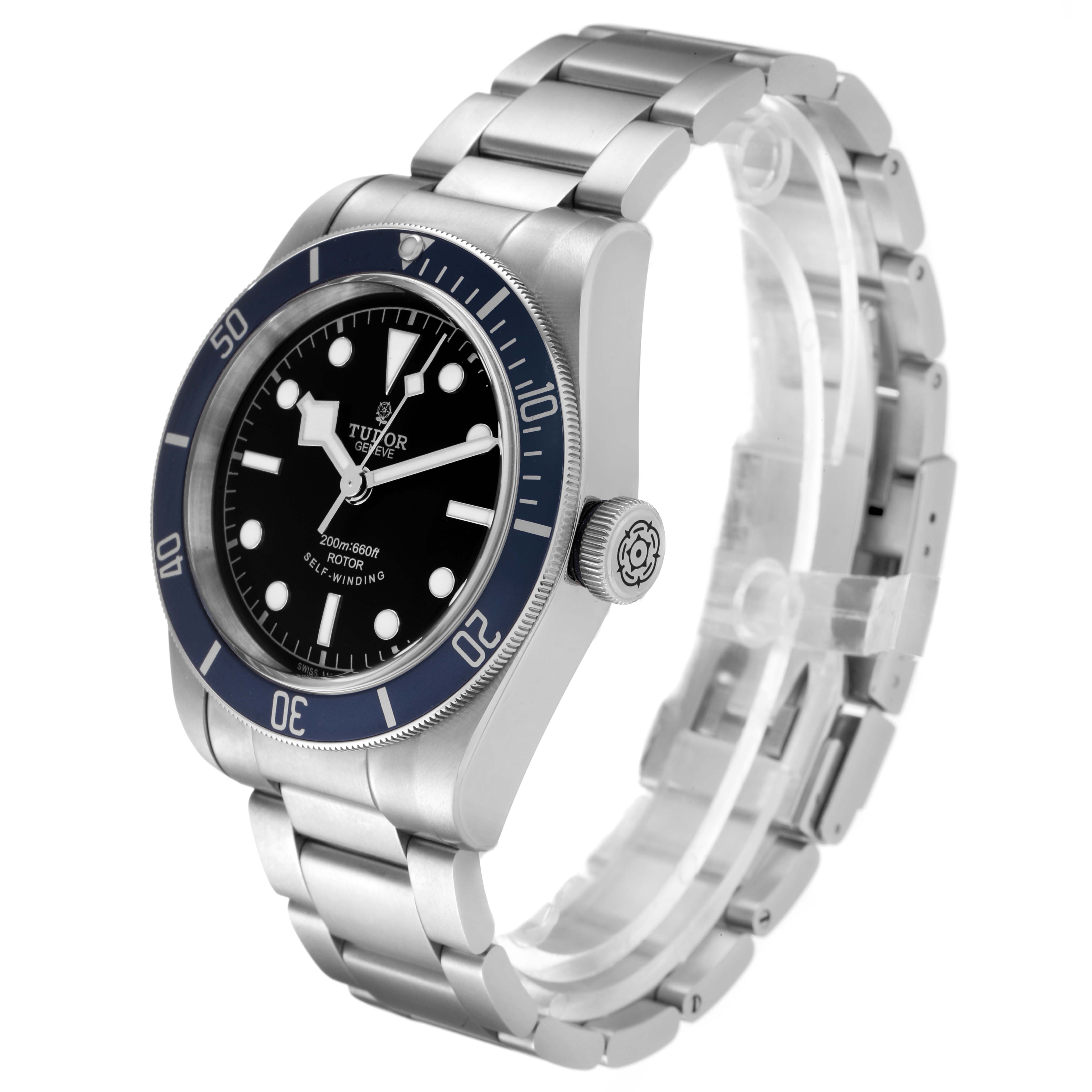 The Tudor Heritage Black Bay 79220 Men's Stainless Steel Black Dial 79220 Men's Stainless Steel Black Dial watch is shown at an angle displaying its face, bezel, crown, and bracelet.