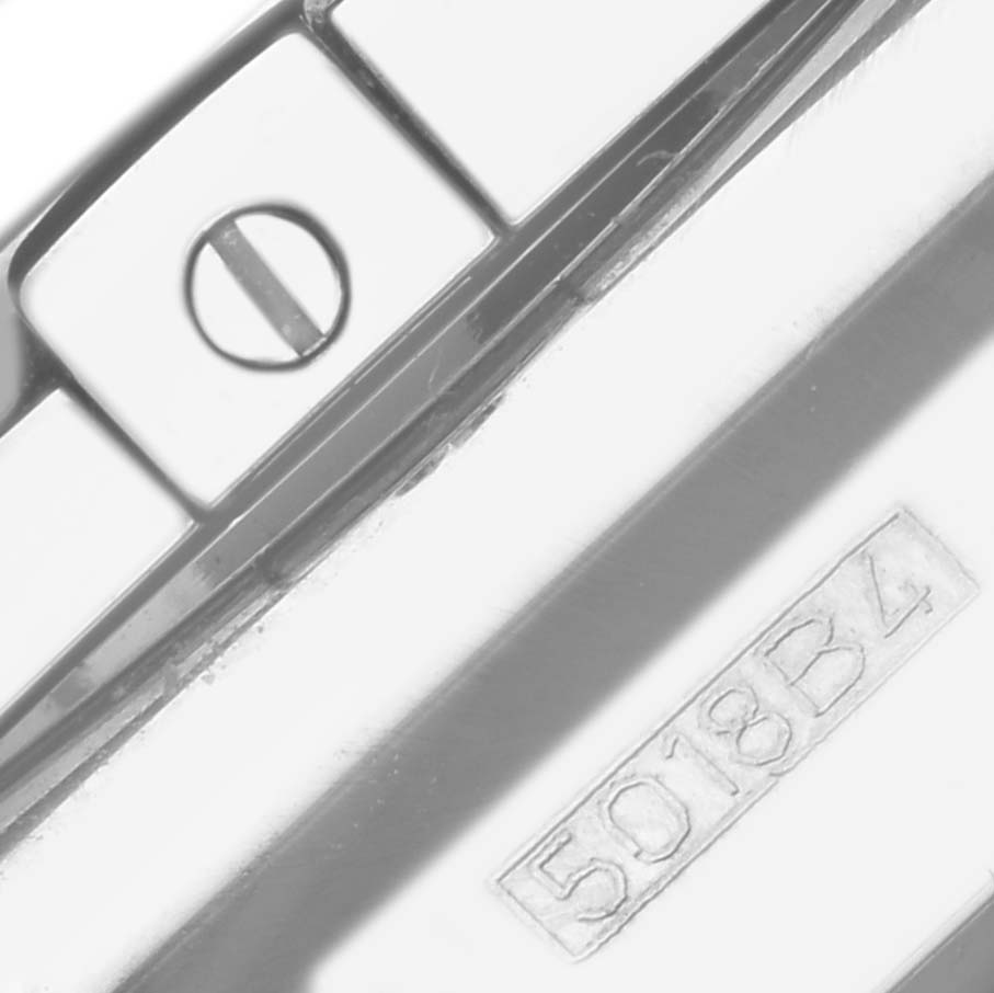 The image shows a close-up of a screw and serial number on the Breitling Chronomat AB0111 Men's Stainless Steel Mother of Pearl Dial AB0111 Men's Stainless Steel Mother of Pearl Dial watch's metal band.