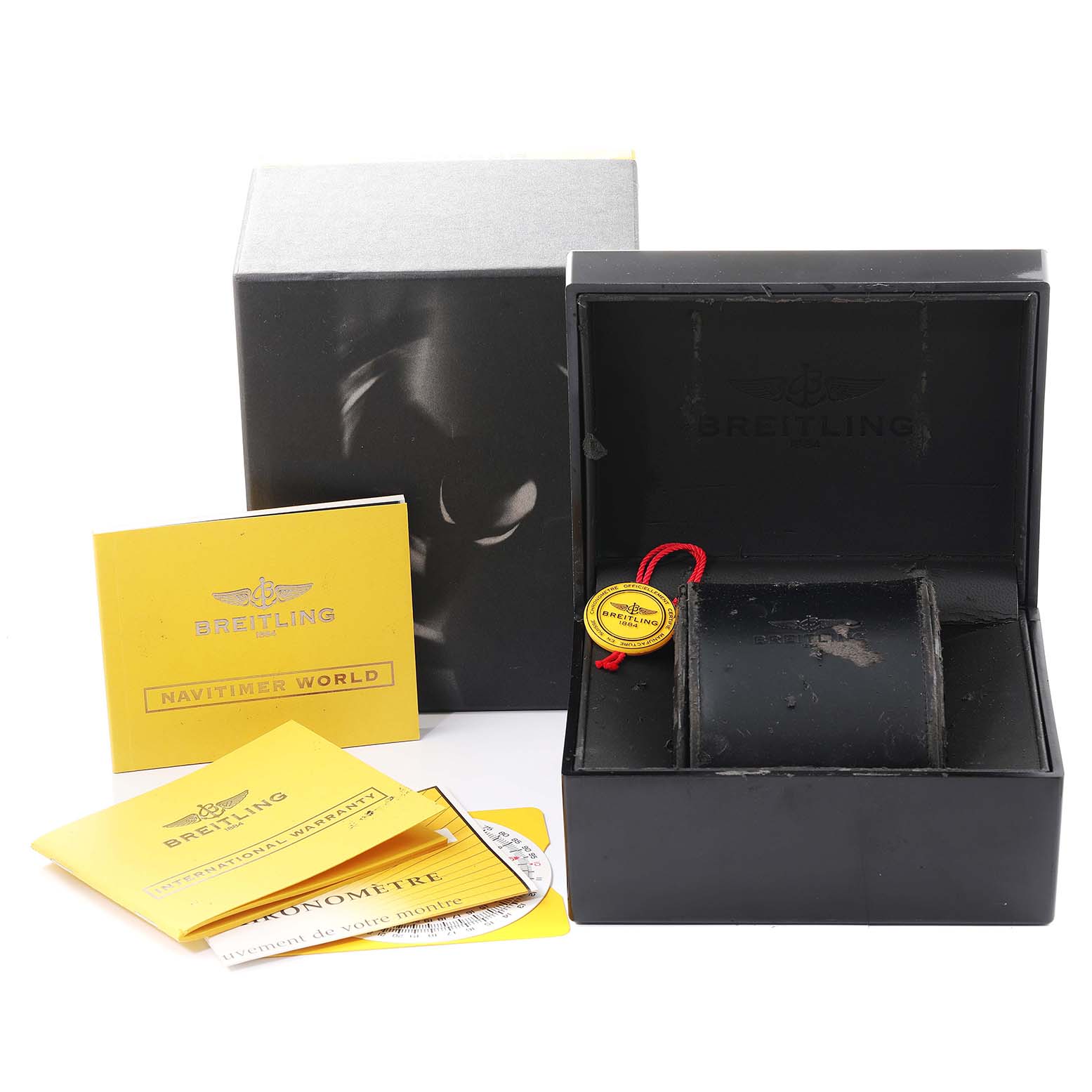 The image shows the packaging box, manual booklets, and warranty card for a Breitling Navitimer A24322 Men's Stainless Steel Silver Dial A24322 Men's Stainless Steel Silver Dial watch, photographed from the front.