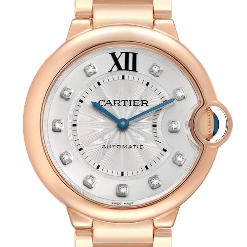The Cartier Ballon Bleu WE902026 Women's Rose Gold Silver Dial watch is shown from the front, highlighting its dial, blue steel hands, and distinctive crown.