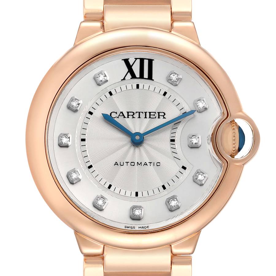 The Cartier Ballon Bleu WE902026 Women's Rose Gold Silver Dial watch is shown from a front angle, highlighting its dial, Roman numeral, diamond markers, and signature crown design.