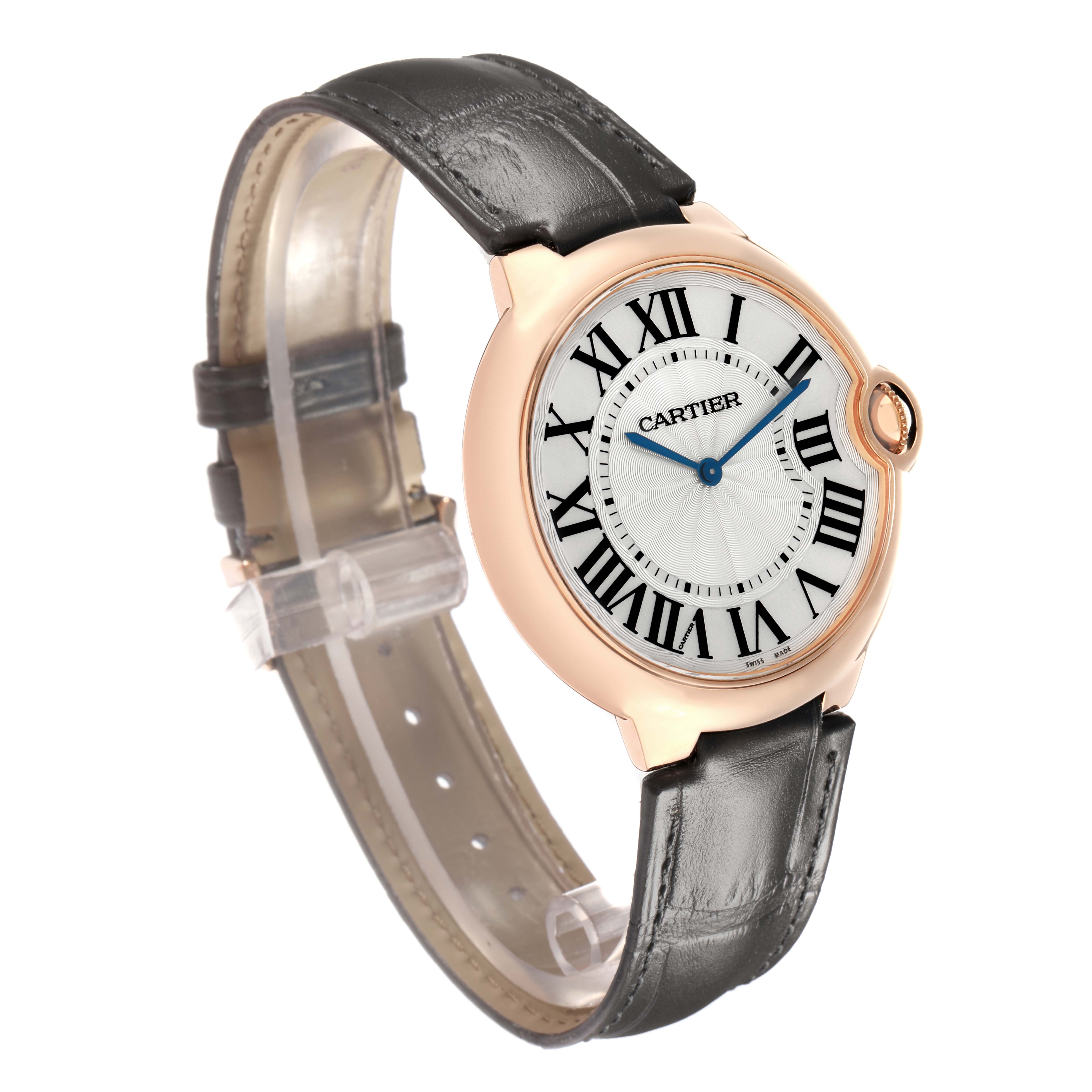The Cartier Ballon Bleu W6920083 Men
s Rose Gold Silver Dial watch is shown at an oblique angle, highlighting its face, bezel, and leather strap.