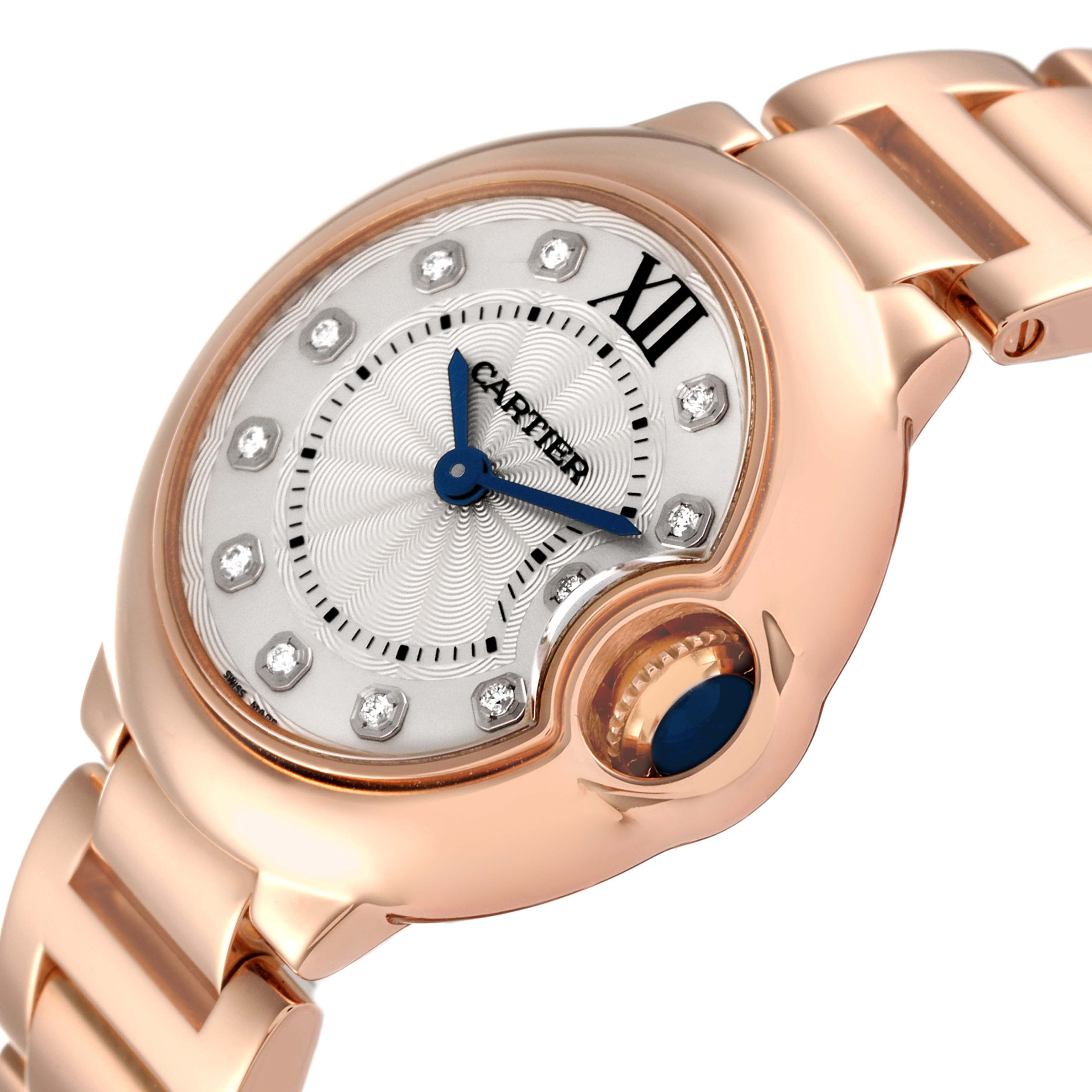 The image shows a close-up angled view of the Ballon Bleu de Cartier watch, highlighting the dial, crown, and part of the bracelet.