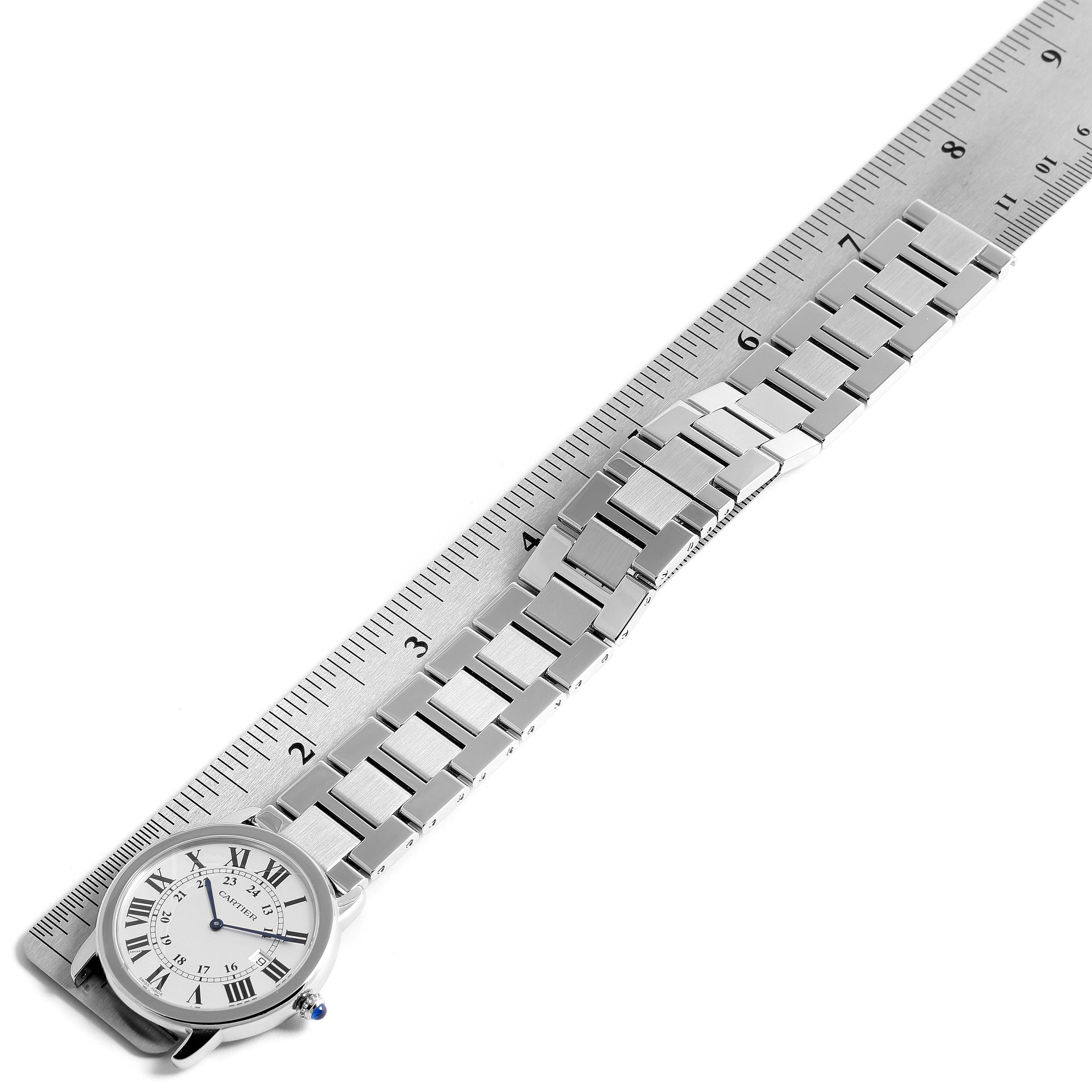 The image shows a Cartier Ronde W6701005 Men's Stainless Steel Silver Dial W6701005 Men's Stainless Steel Silver Dial model watch with a metal bracelet, laid flat against a ruler for measurement.