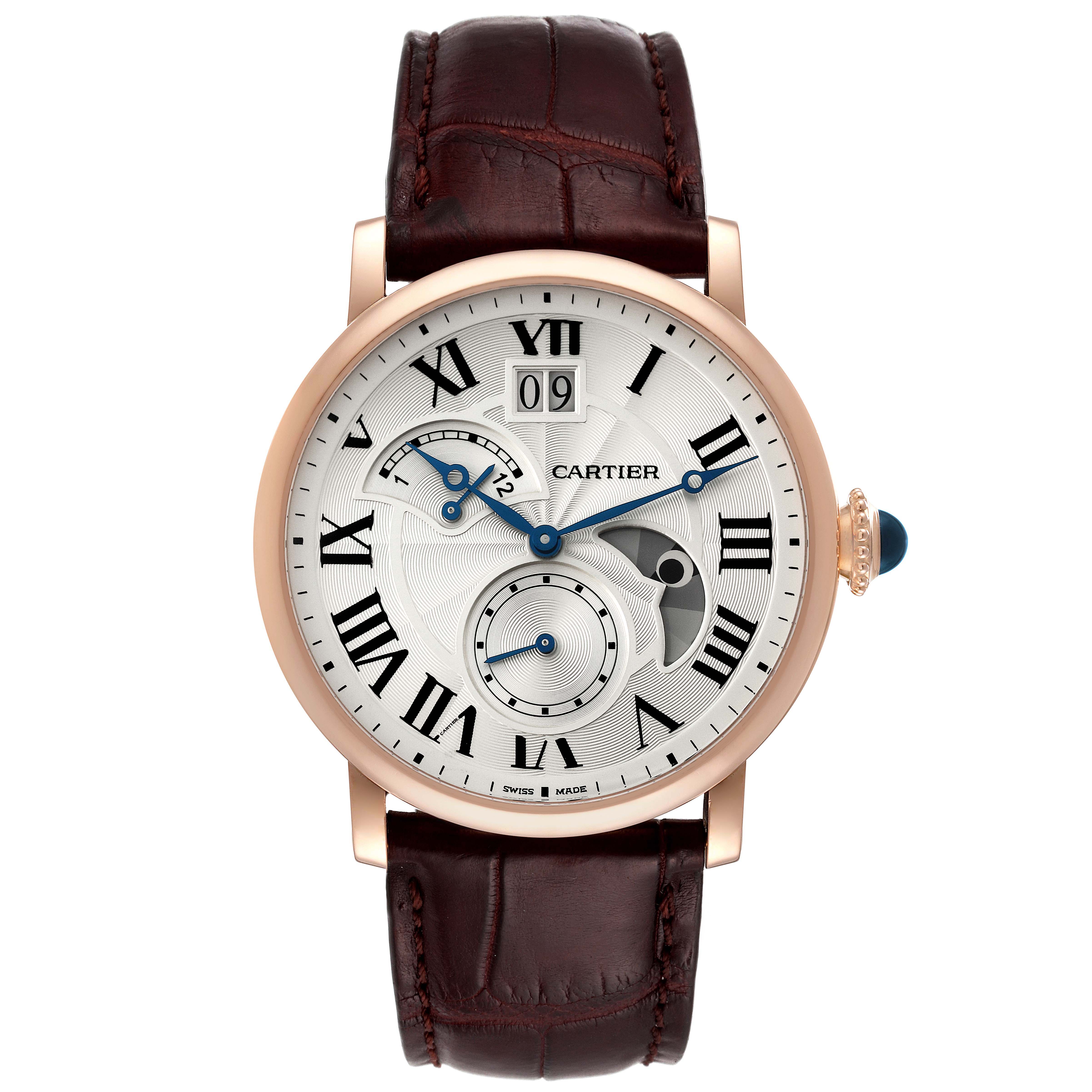 The image shows a front view of a Rotonde de Cartier watch with a leather strap and intricate dial details.
