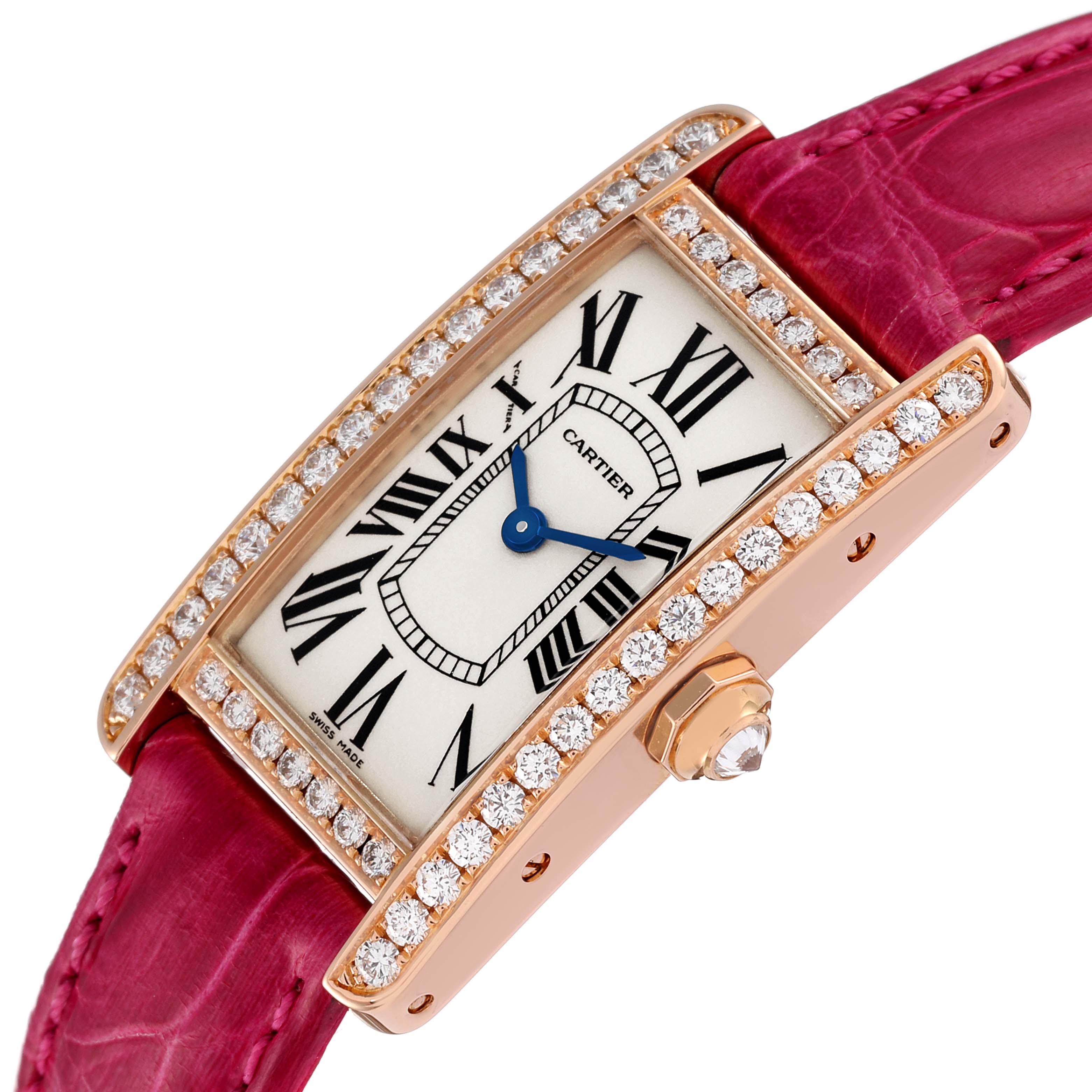 The image shows a close-up of a Cartier Tank Americaine WJTA0002 Women
s Rose Gold Silver Dial WJTA0002 Women
s Rose Gold Silver Dial watch with a diamond bezel and red leather strap, angled slightly downward.