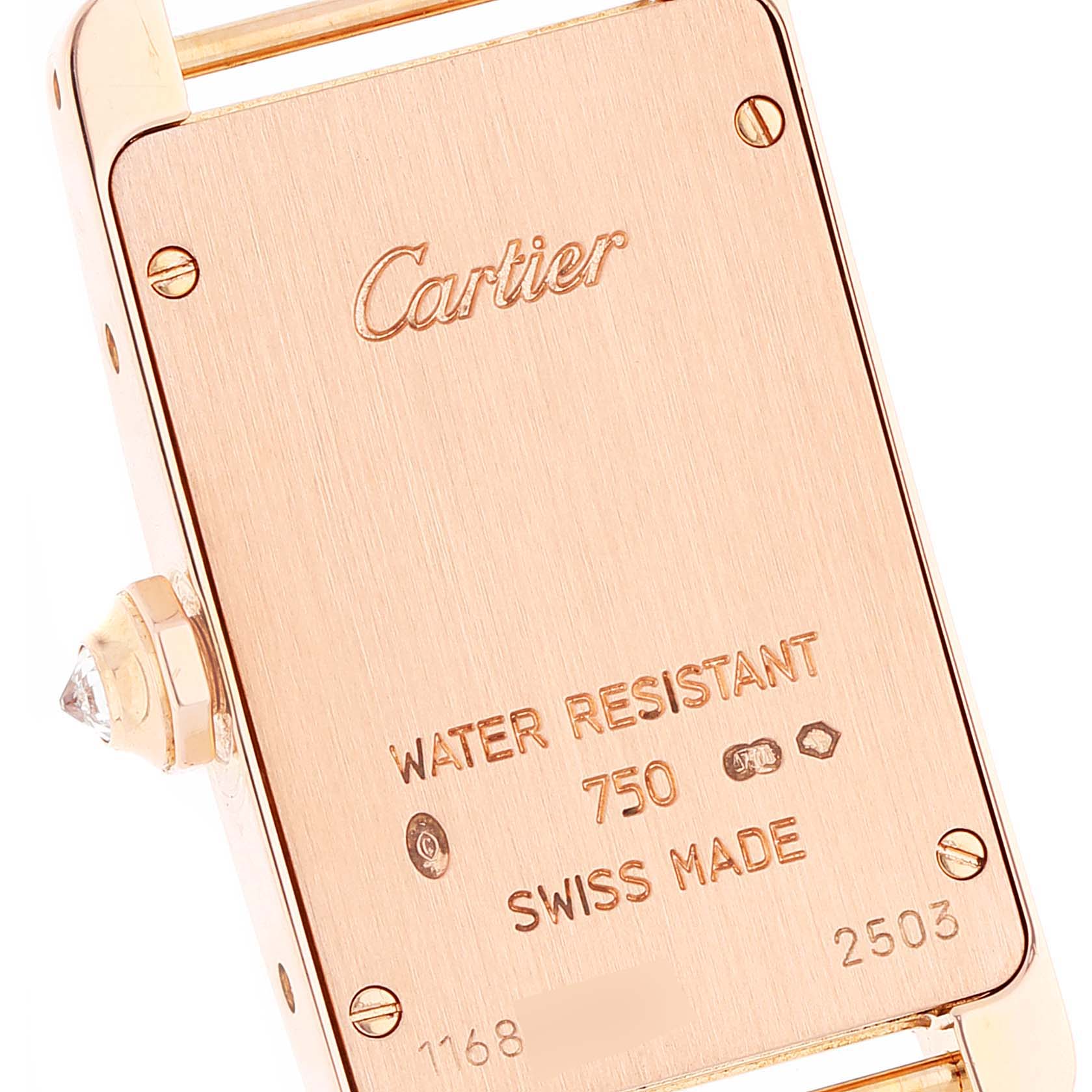 This image shows the back case of the Cartier Tank Américaine watch, highlighting the brand logo, markings, and crown side.