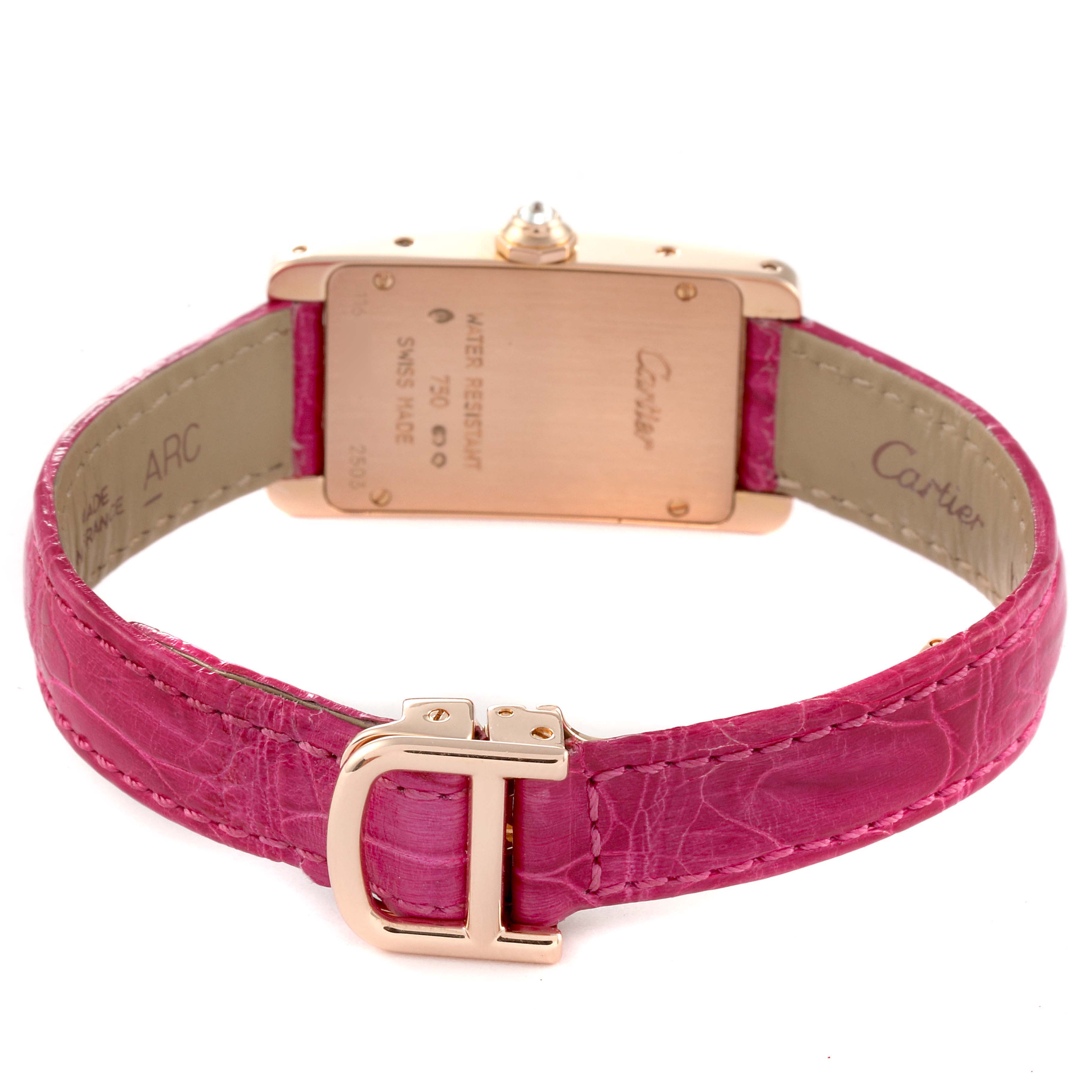 The image shows the back and clasp of the Cartier Tank Americaine WJTA0002 Women
s Rose Gold Silver Dial WJTA0002 Women
s Rose Gold Silver Dial watch with a pink leather strap.