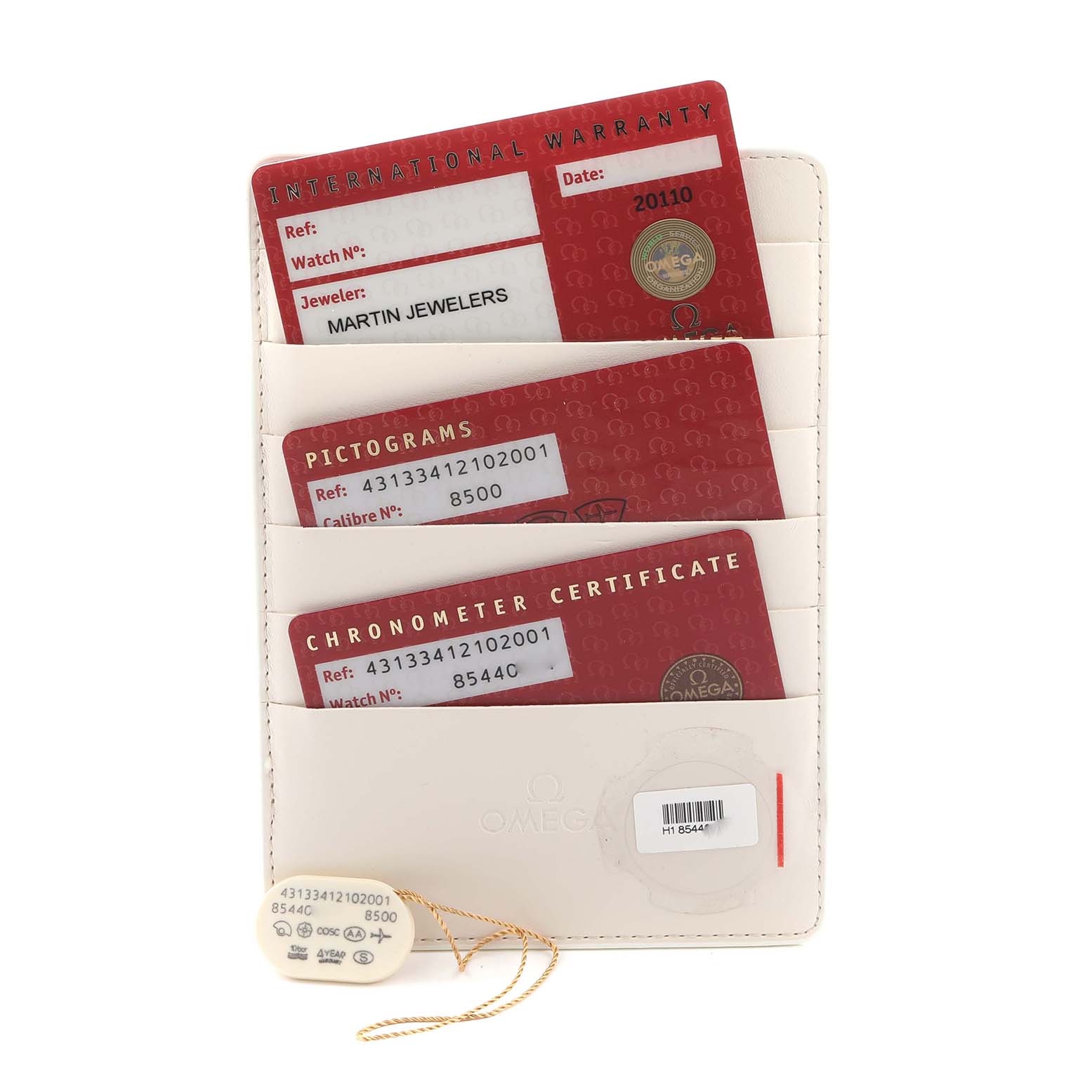 The image shows warranty cards and a chronometer certificate for an Omega De Ville 431.33.41.21.02.001 Men
s Stainless Steel Silver Dial watch displayed in a holder.