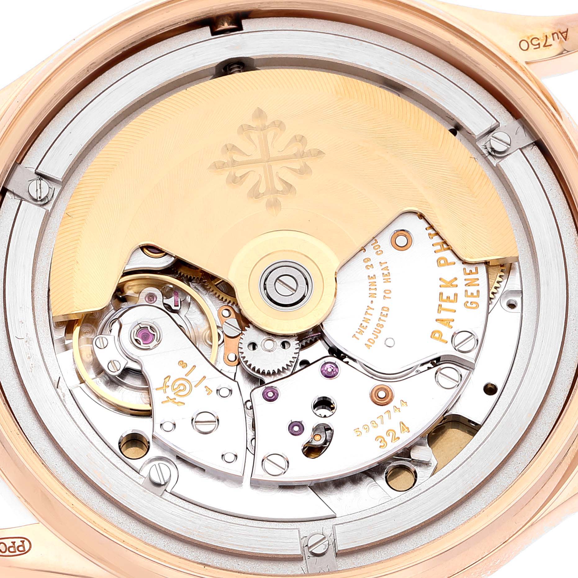 The image shows the intricate movement and inner mechanisms of a Patek Philippe Calatrava 5296R Men's Rose Gold Silver Dial 5296R Men's Rose Gold Silver Dial watch from a close-up angle.