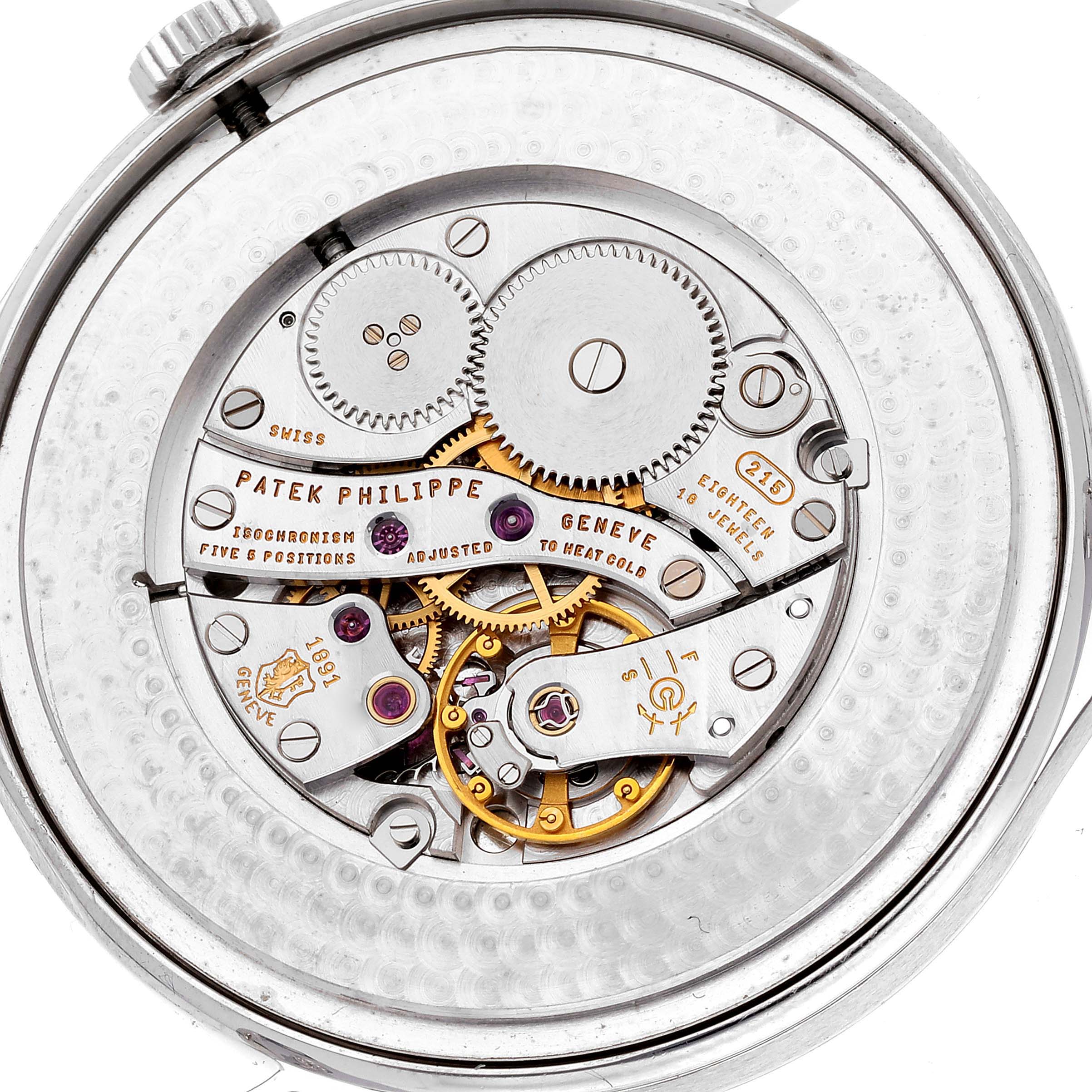 This image shows the movement of a Patek Philippe Calatrava 5196P-001 Men
s Platinum Silver Dial 5196P-001 Men
s Platinum Silver Dial watch from a rear angle, highlighting its gear mechanisms and inscriptions.