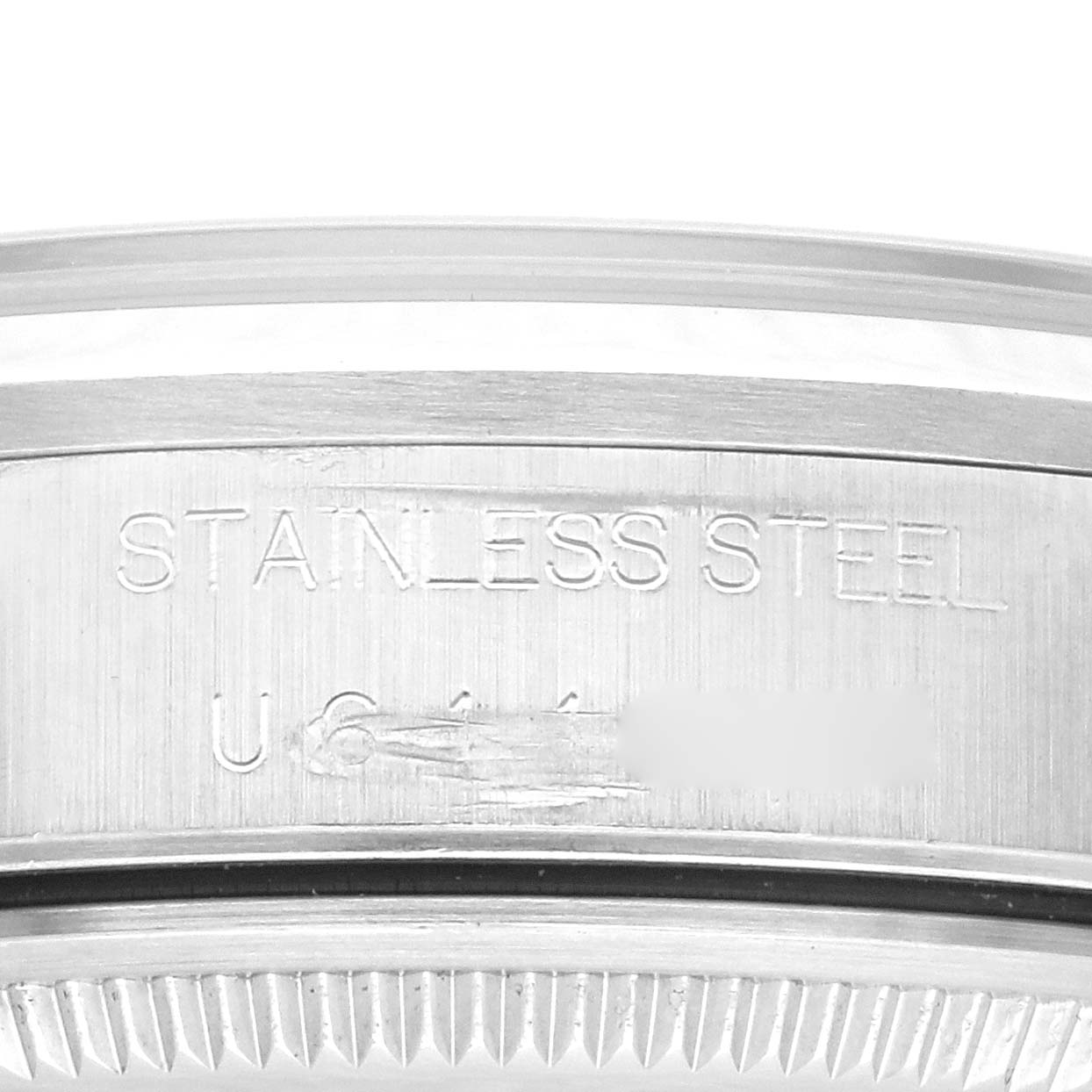 The image shows a close-up of the engraved side of the stainless steel case on a Rolex Air-King 14000 Men's Stainless Steel Black Dial 14000 Men's Stainless Steel Black Dial watch.
