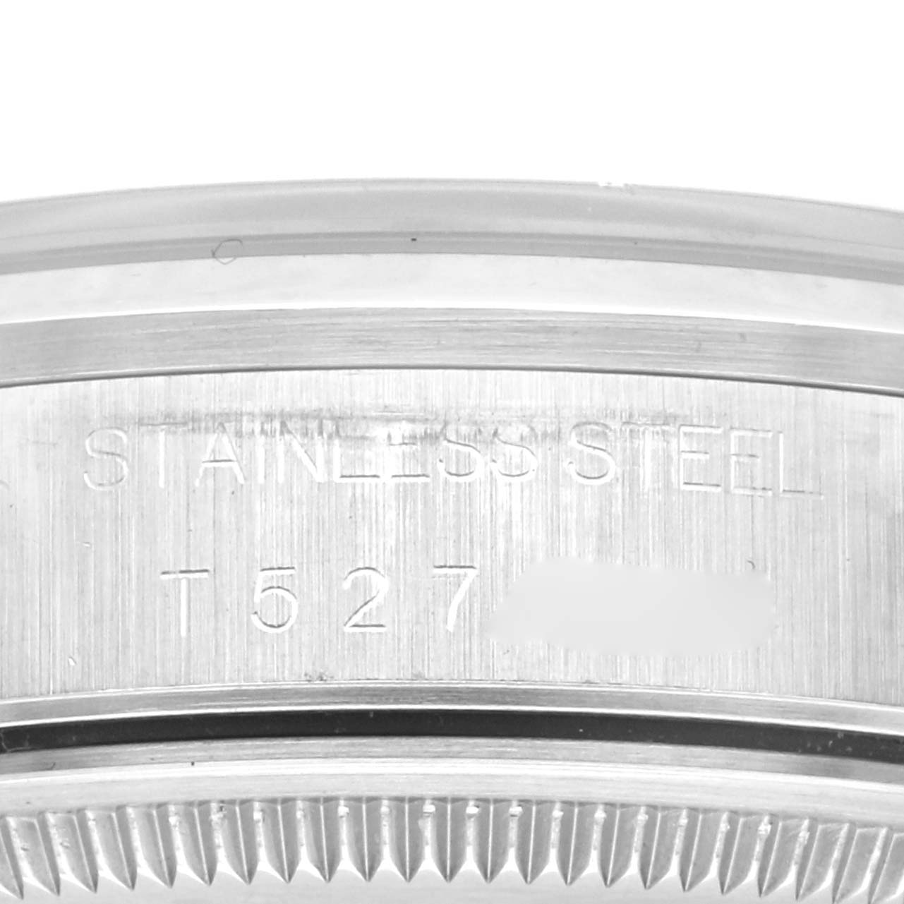 The image shows a close-up angle of the case edge of the Rolex Air-King 14000 Men's Stainless Steel Pink Dial 14000 Men's Stainless Steel Pink Dial, highlighting the stainless steel engraving.