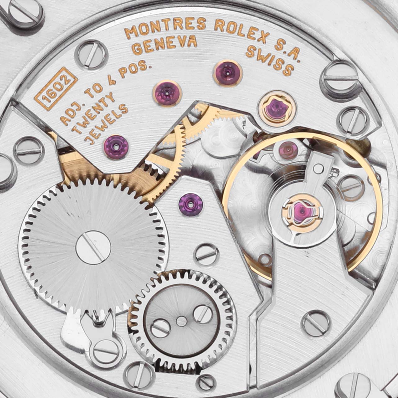 This image shows the intricate movement of a Rolex Cellini 5115 Men's Yellow Gold Silver Dial 5115 Men's Yellow Gold Silver Dial watch, showcasing gears and jewels from a top-down view.