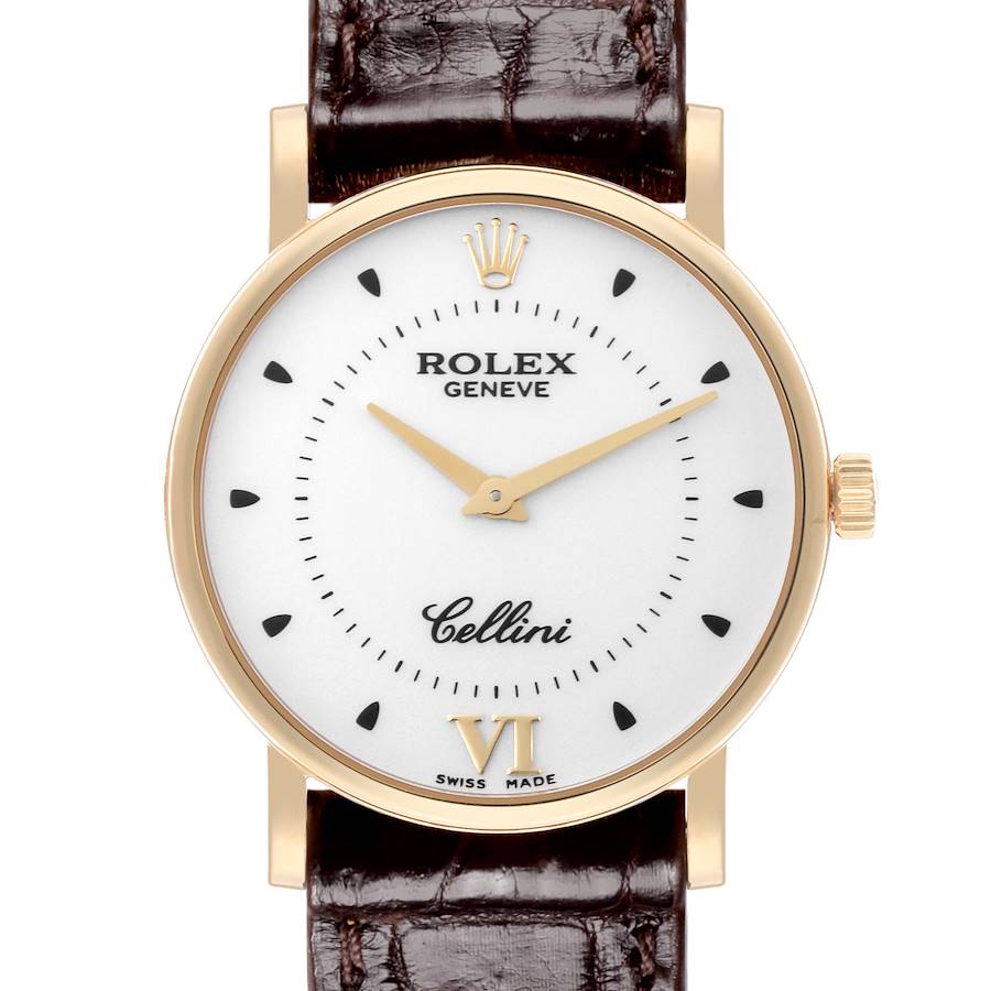 The Rolex Cellini watch is shown from a front angle, displaying the dial, bezel, crown, and leather strap.