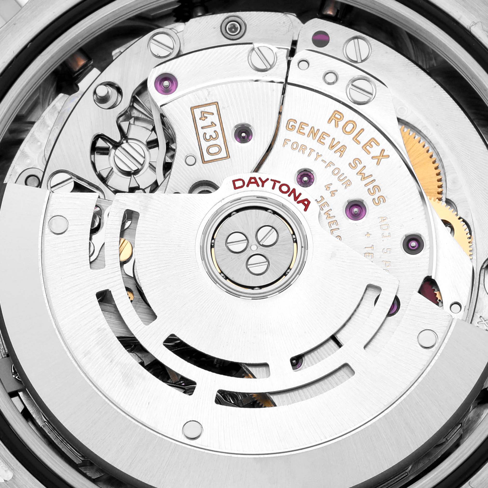 The image shows a close-up of the Rolex Daytona 116509 Men's White Gold Black Dial 116509 Men's White Gold Black Dial movement, highlighting gears and engravings at an overhead angle.