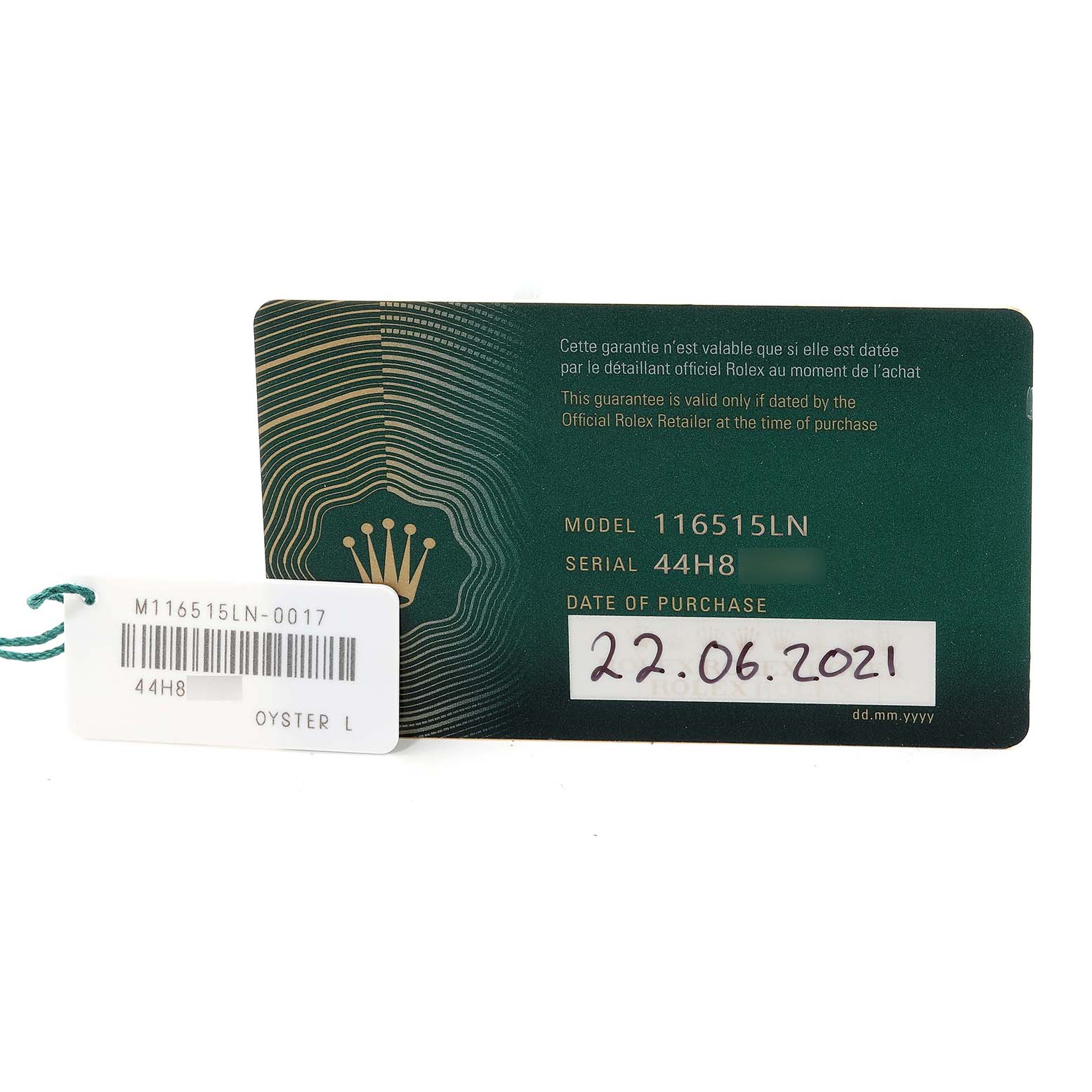 The image shows the guarantee card and tag for a Rolex Daytona 116515LN Men's Rose Gold Black Dial 116515LN Men's Rose Gold Black Dial model 116515LN.