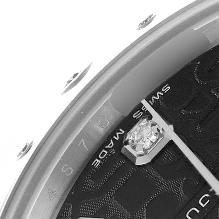 The image shows a close-up of the dial, bezel, and diamond marker on a mid-size Rolex watch from a slightly angled perspective.