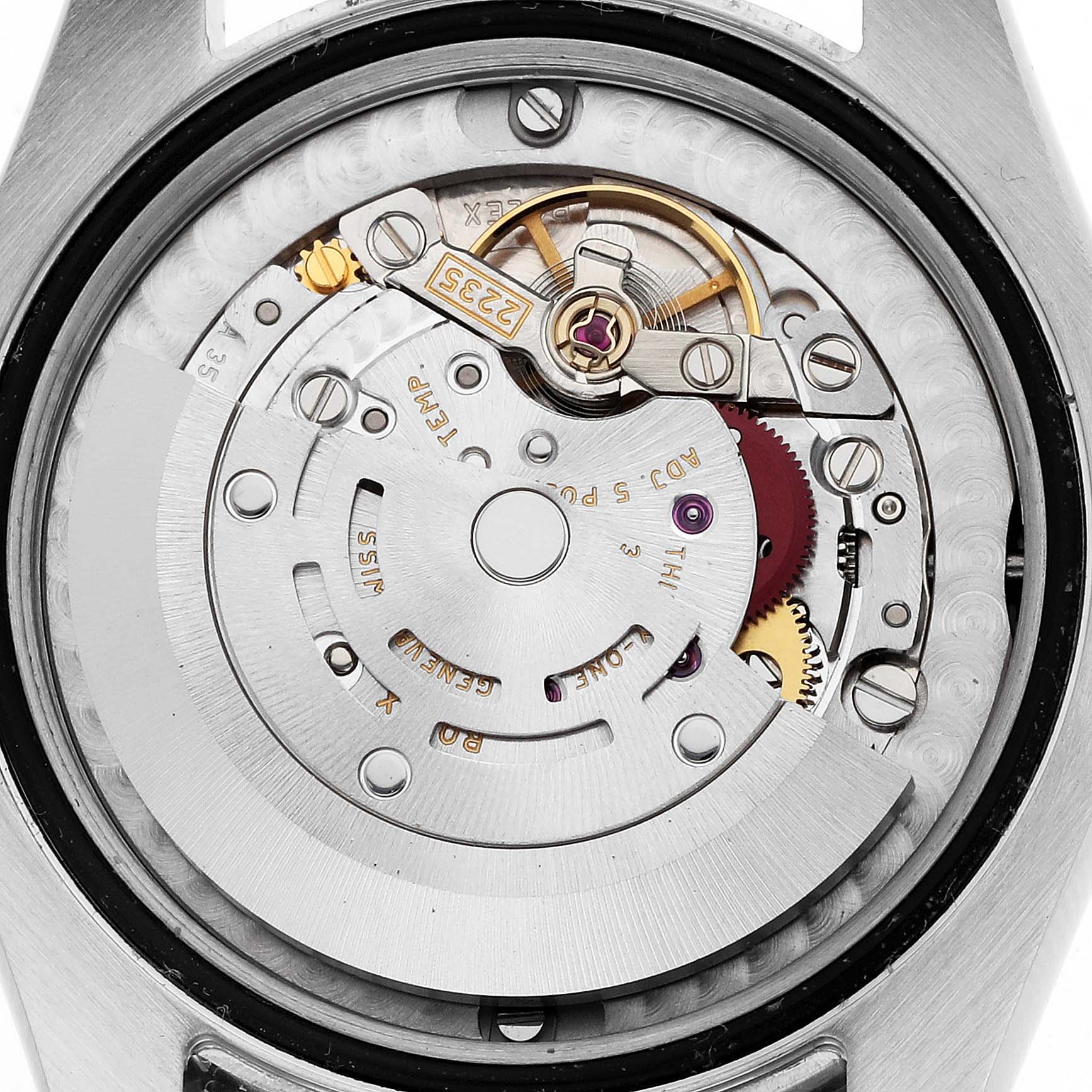The image shows the movement mechanism of a mid-size Rolex watch from a rear angle, highlighting gears and rotors.