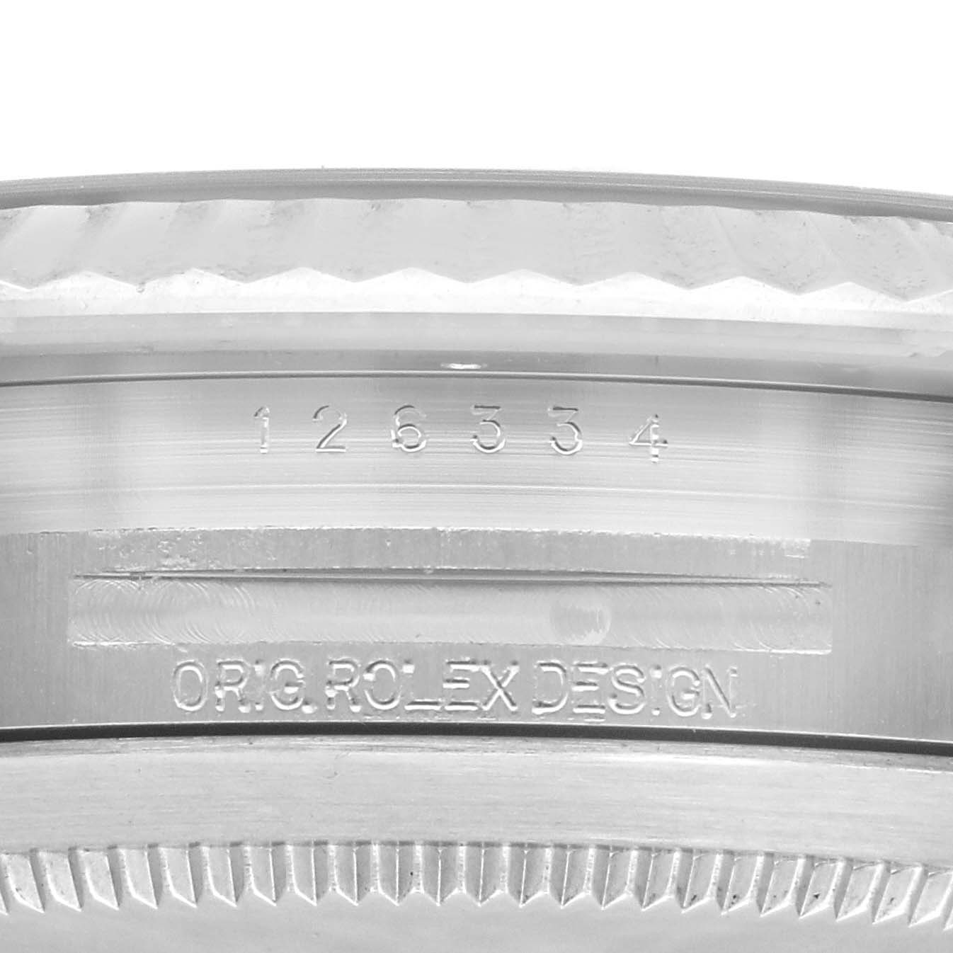 The image shows a close-up of the side of the Rolex Datejust 41 126334 Men
s Stainless Steel Blue Dial 126334 Men
s Stainless Steel Blue Dial, highlighting engraving details on the bezel.