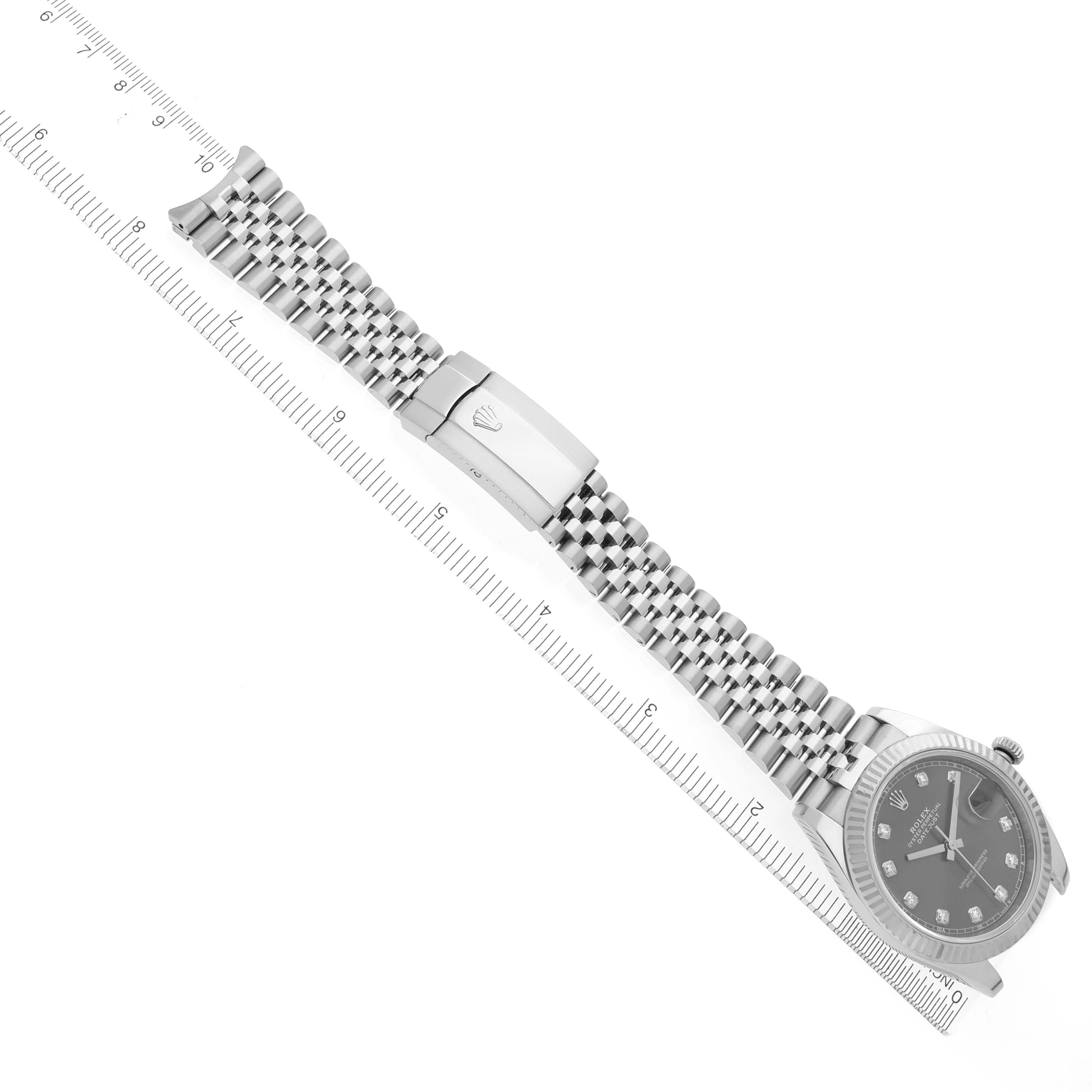 The image shows a Rolex Datejust 41 126334 Men
s Stainless Steel Grey Dial 126334 Men
s Stainless Steel Grey Dial watch with a bracelet and clasp, captured at a top-down angle with measuring rulers.