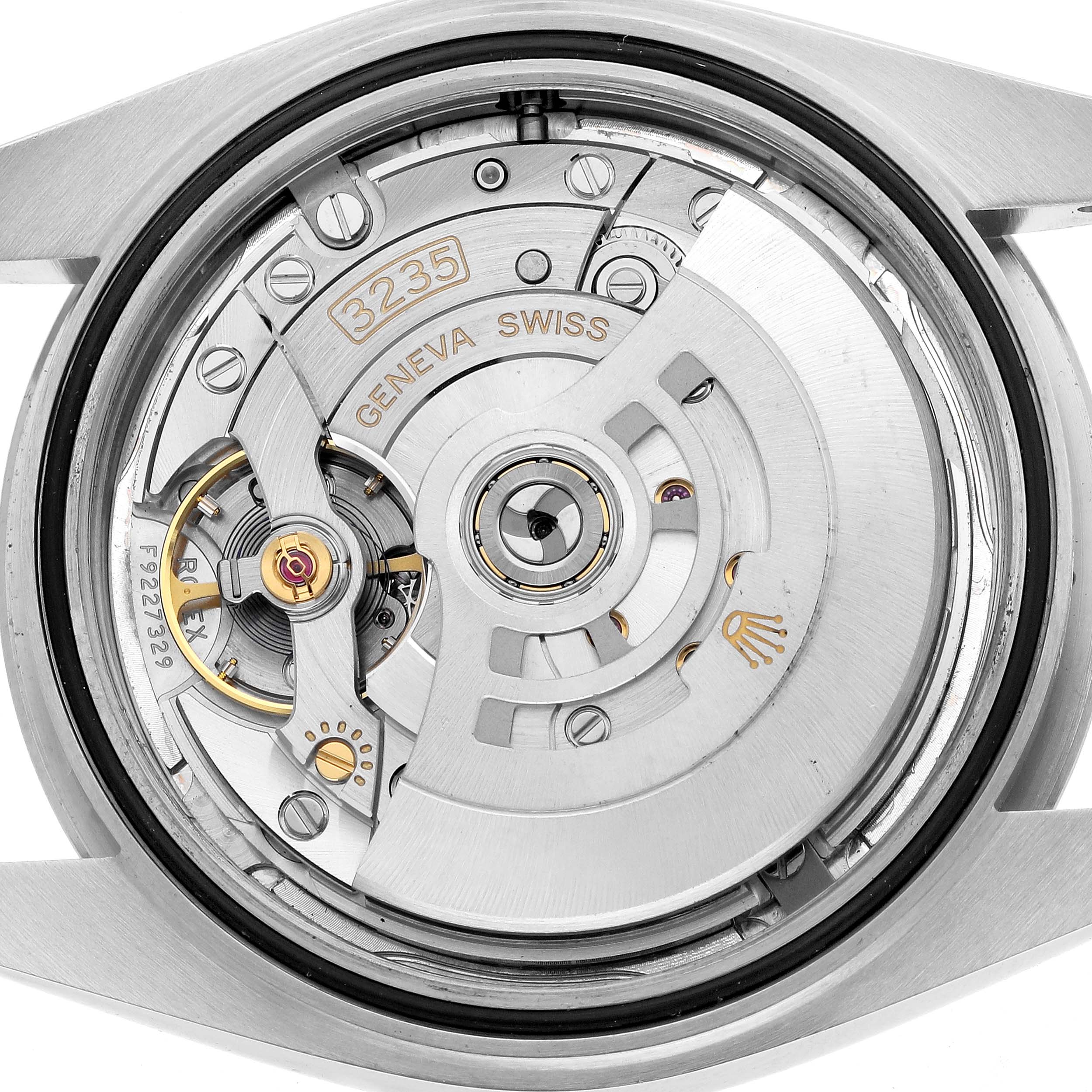 The image shows the movement of a Rolex Datejust 41 126334 Men
s Stainless Steel Silver Dial, displaying its inner mechanism from the rear.