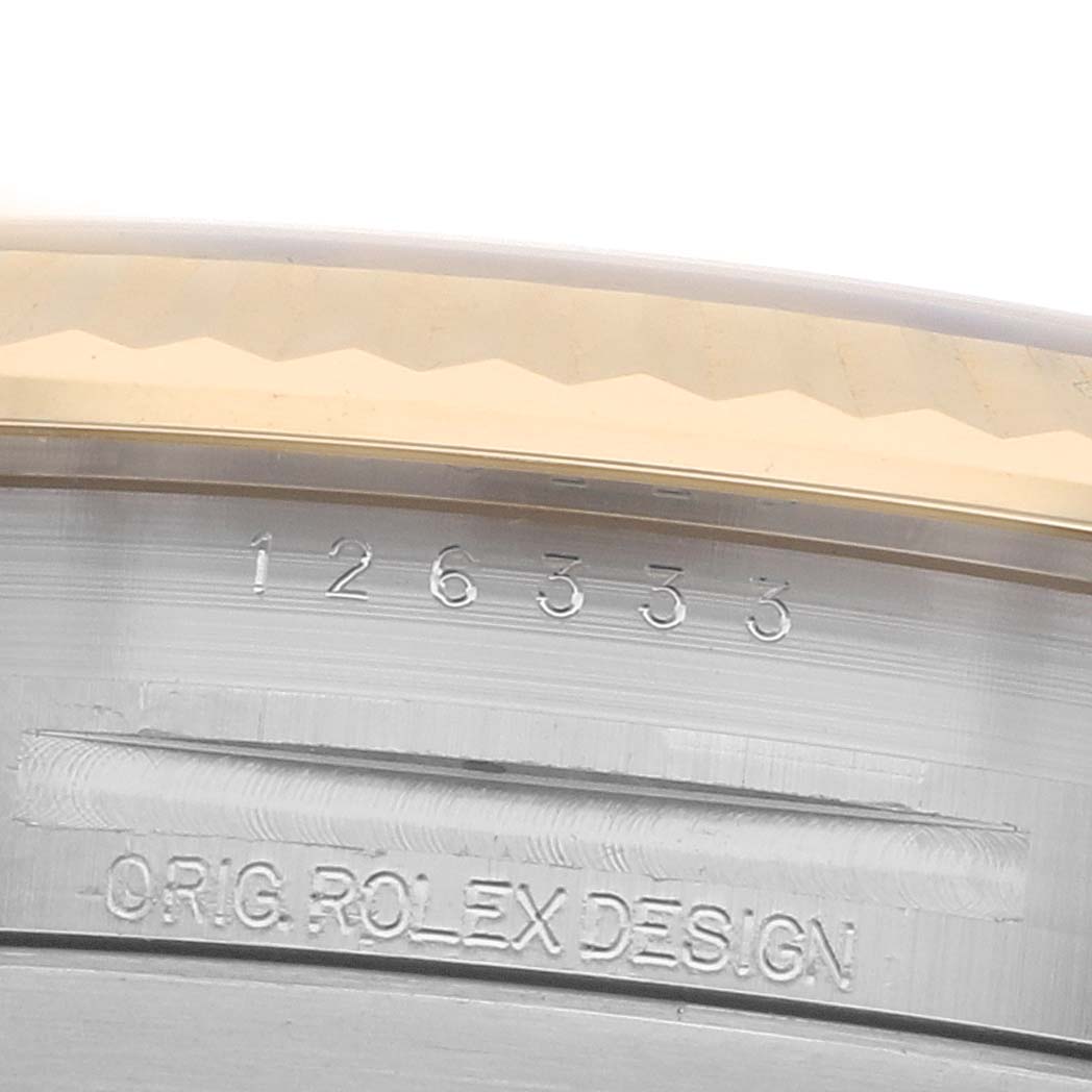The image shows a close-up of the side of a Rolex Datejust 41 126333 Men
s Steel and Gold (two tone) Silver Dial, highlighting the engraved model number and "Orig. Rolex Design."