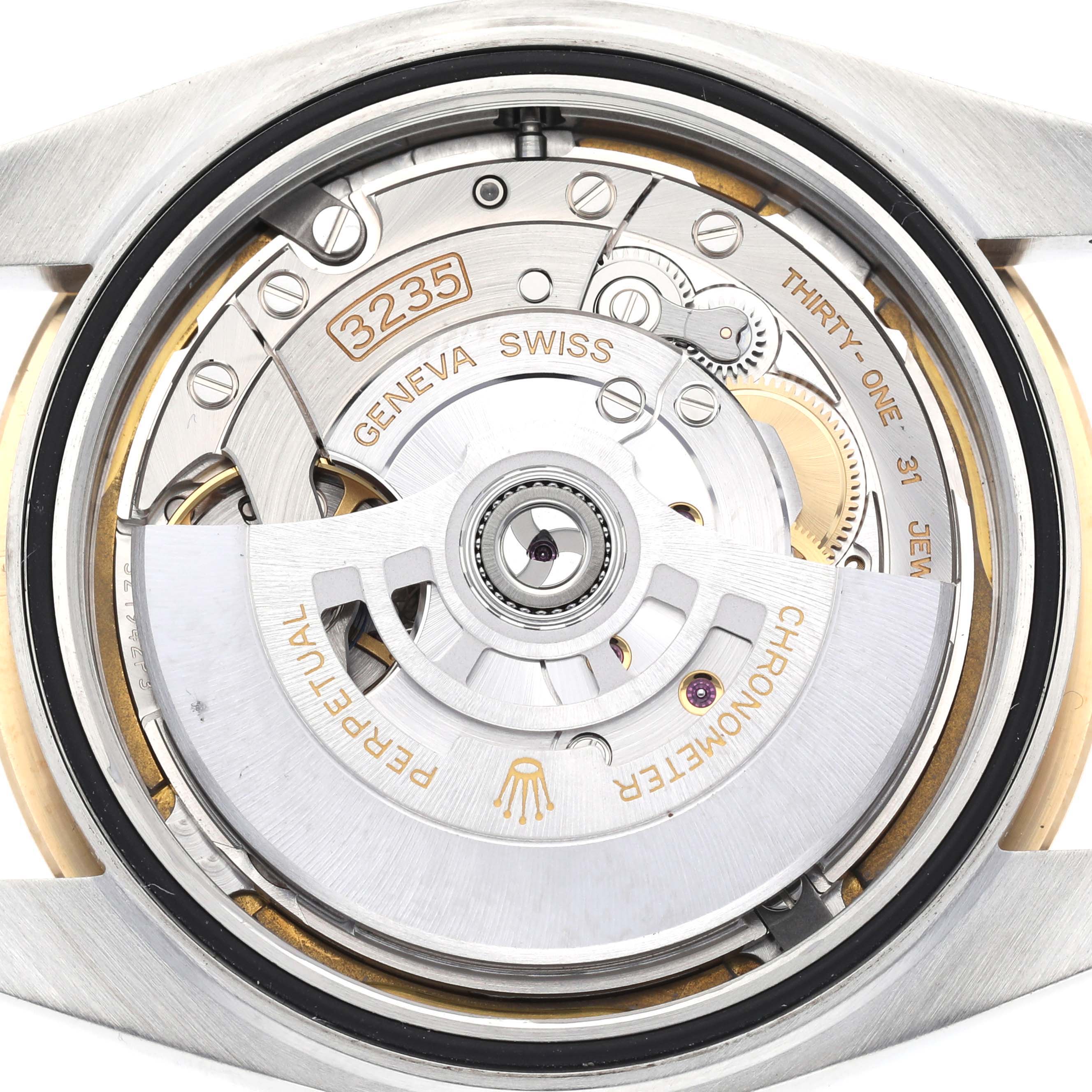 The image shows the back and inside mechanism of a Rolex Datejust 41 126333 Men's Steel and Gold (two tone) White Dial 126333 Men's Steel and Gold (two tone) White Dial, featuring its rotor and movement parts.