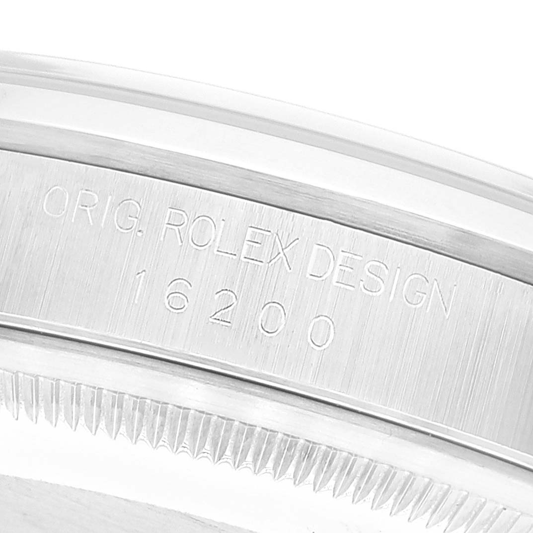 This close-up view shows the engraving on the case of a Rolex Datejust 16200 Men's Stainless Steel Black Dial 16200 Men's Stainless Steel Black Dial model watch.