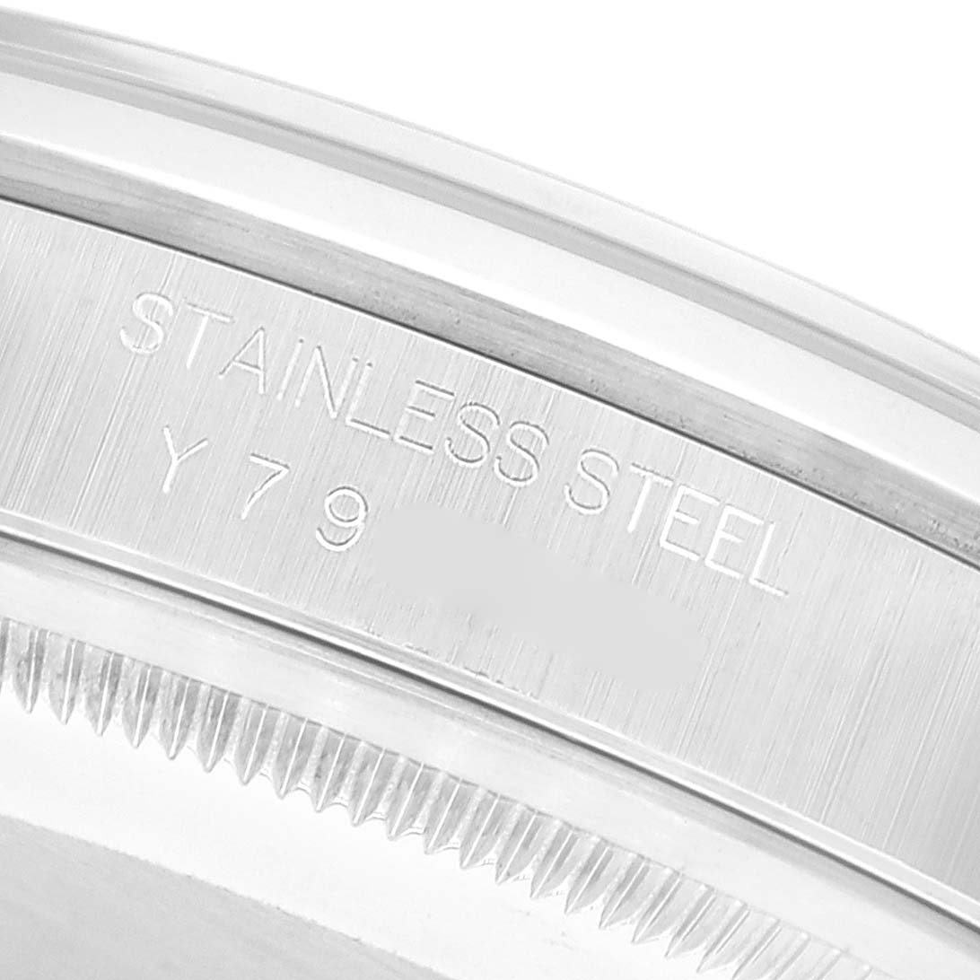 This image shows a close-up of the case back of a Rolex Datejust 16200 Men's Stainless Steel Black Dial 16200 Men's Stainless Steel Black Dial watch, highlighting the engraved text and stainless steel material.