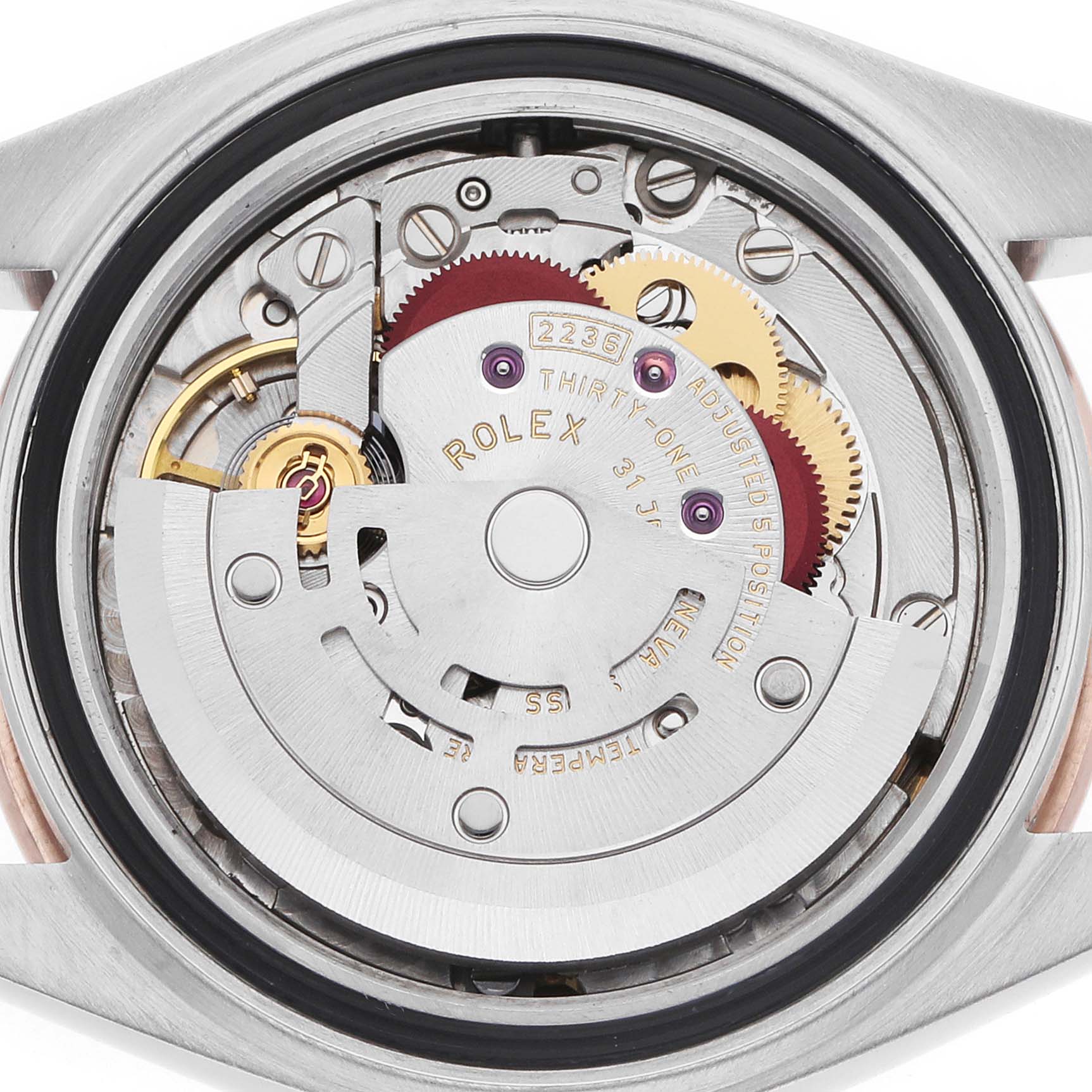 The image shows the back view of a Rolex Datejust 279381 Women
s Steel and Gold (two tone) Mother of Pearl Dial, highlighting its intricate movement and mechanical components.