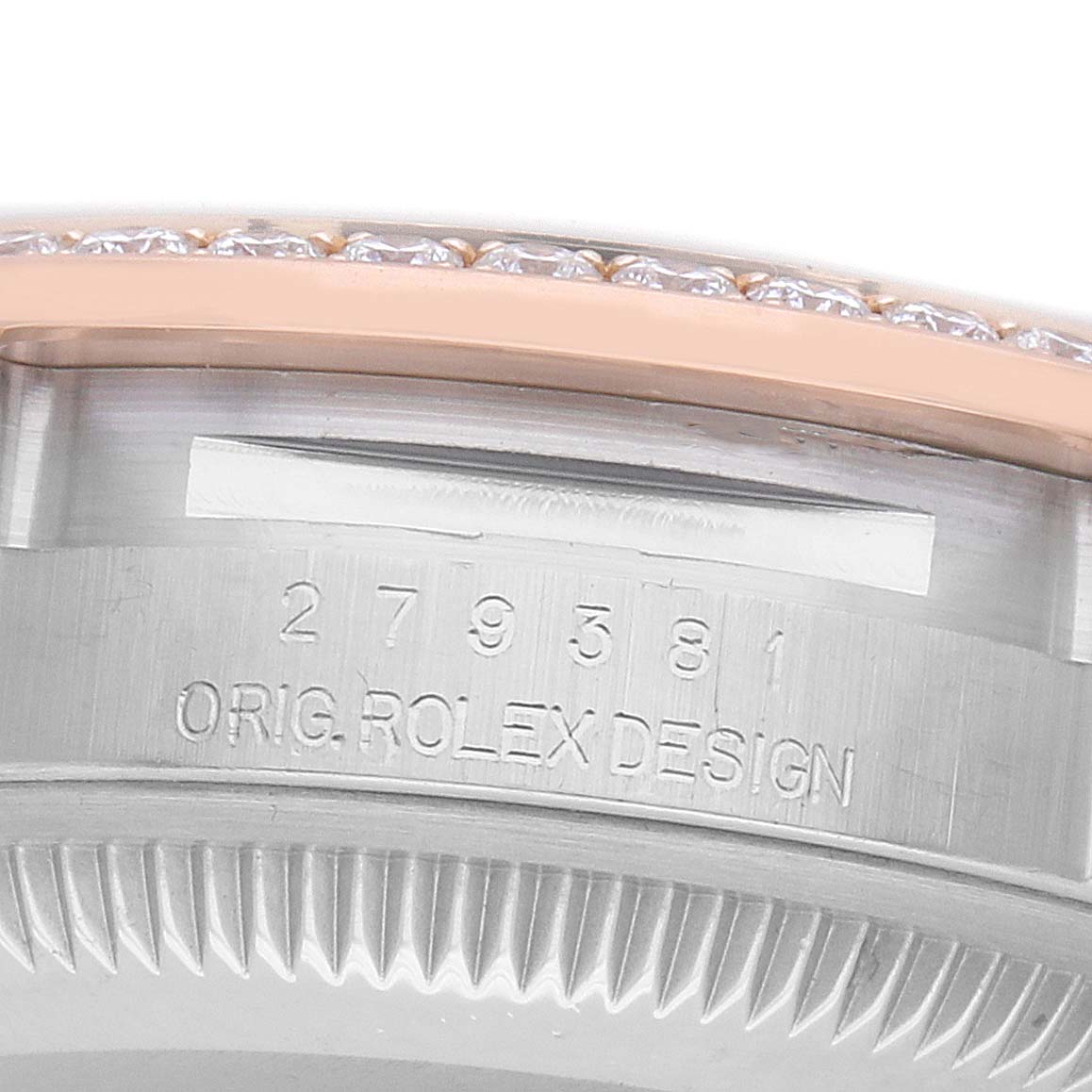 The image shows a close-up of the Rolex Datejust 279381 Women
s Steel and Gold (two tone) Mother of Pearl Dial
s case side, displaying part of the bezel and engraved model detailing.