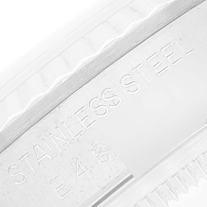 The image shows a close-up of the serial number engraving on the stainless steel case of a Rolex Datejust 16234 Men's Stainless Steel Silver Dial 16234 Men's Stainless Steel Silver Dial watch.