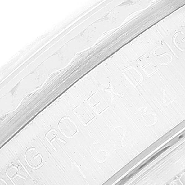 This image shows a close-up of the engraved text on the inner bezel of a Rolex Datejust 16234 Men's Stainless Steel Silver Dial 16234 Men's Stainless Steel Silver Dial watch.