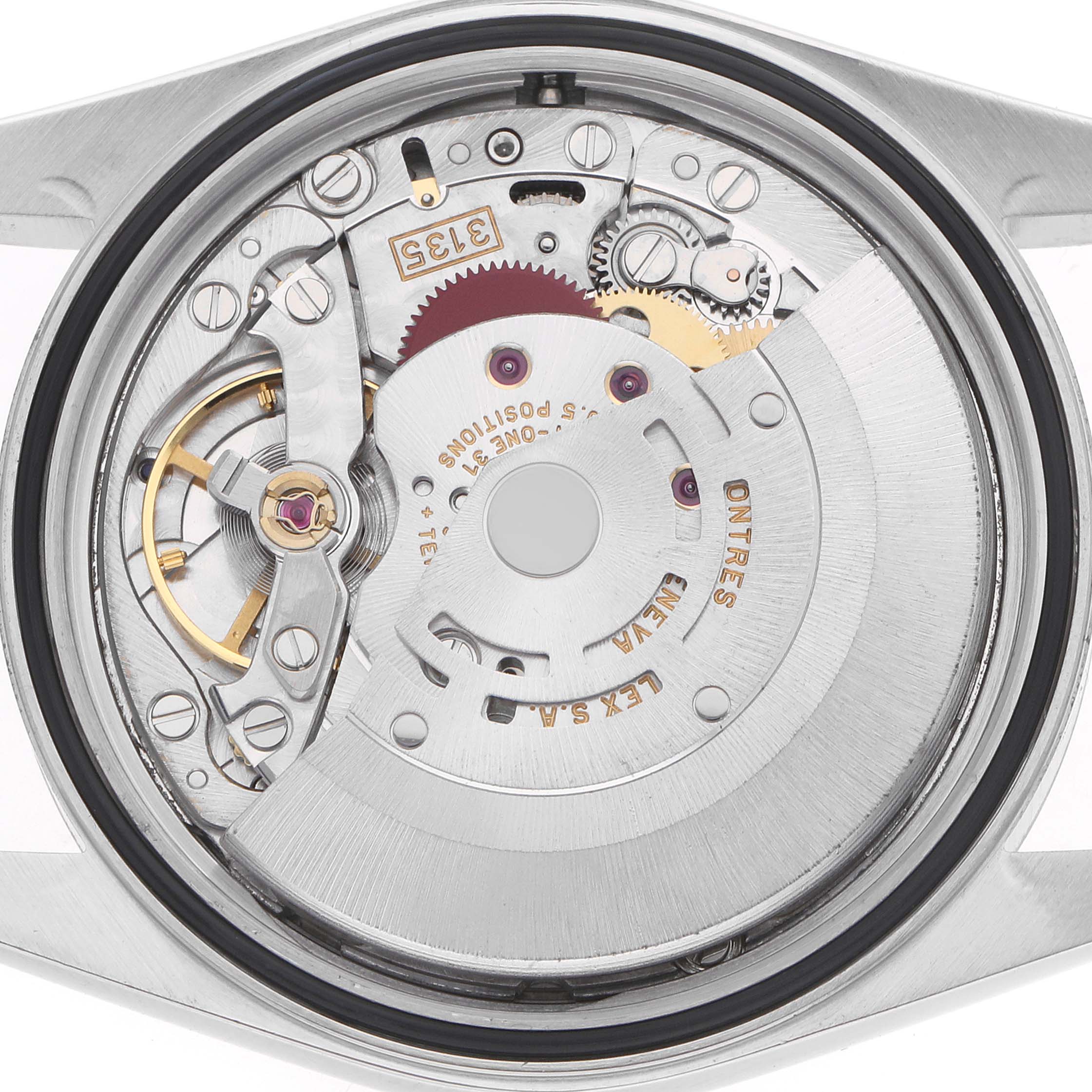 The image shows the movement of a Rolex Datejust 16233 Men
s Steel and Gold (two tone) Silver Dial from a back view, revealing gears and mechanical components.