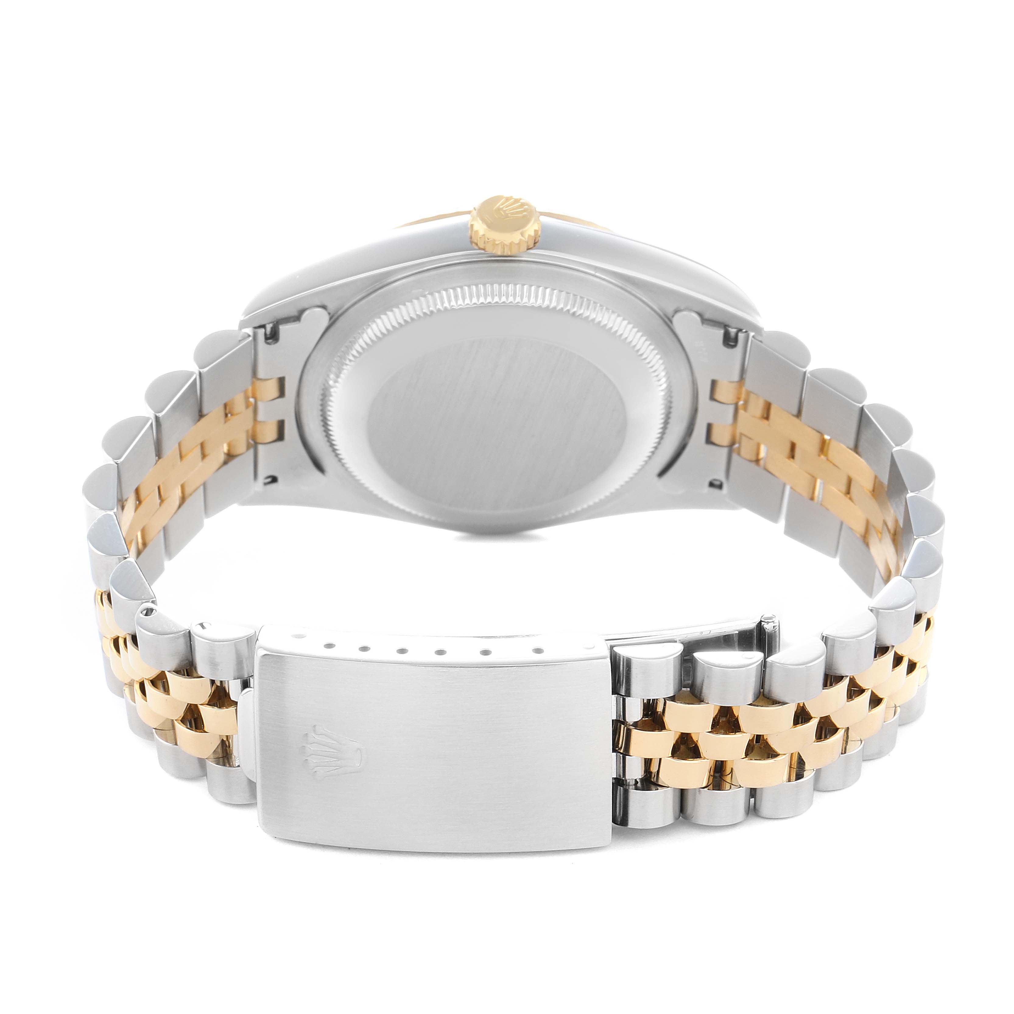 The image shows the back of a Rolex Datejust 16233 Men
s Steel and Gold (two tone) Silver Dial watch focusing on the case back, crown, and two-tone bracelet with a clasp.
