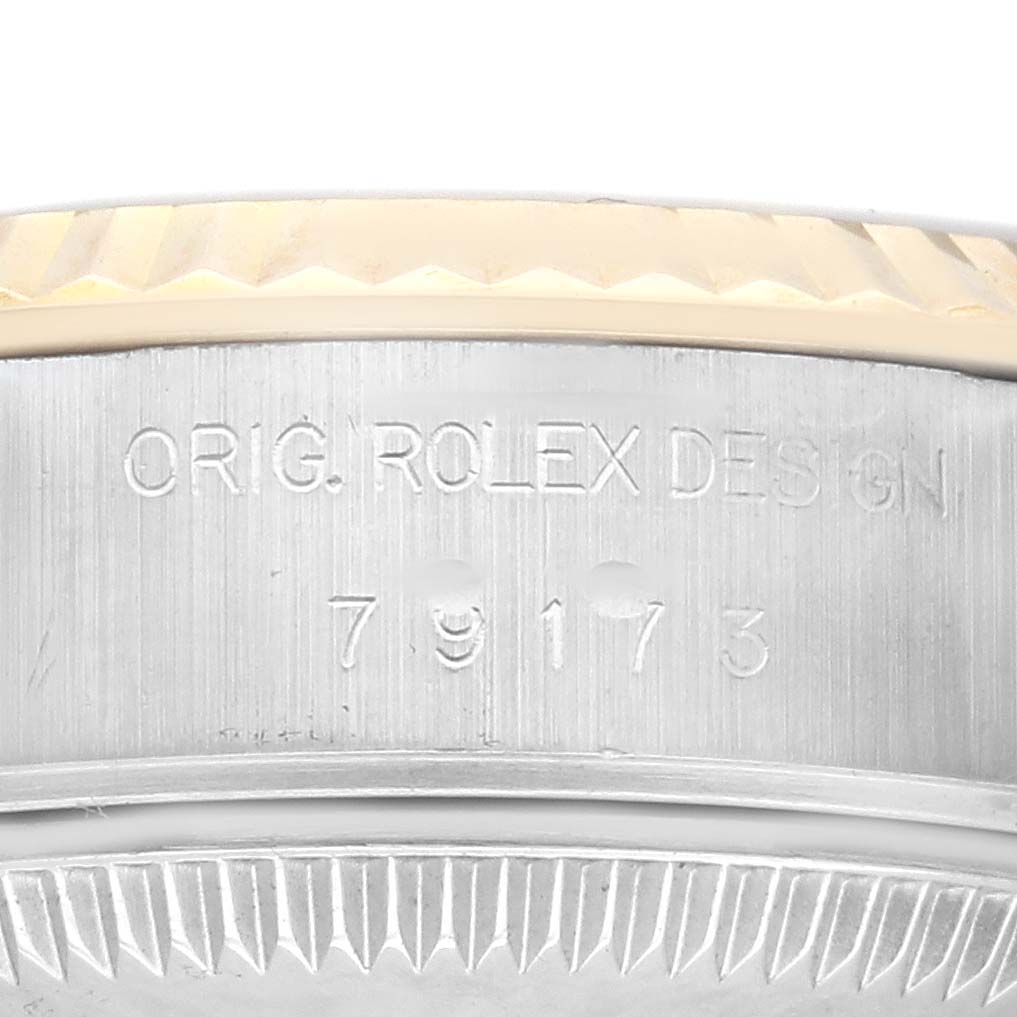 The image shows a close-up of the case side and bezel of the Rolex Datejust 79173 Women's Steel and Gold (two tone) Champagne Dial 79173 Women's Steel and Gold (two tone) Champagne Dial.