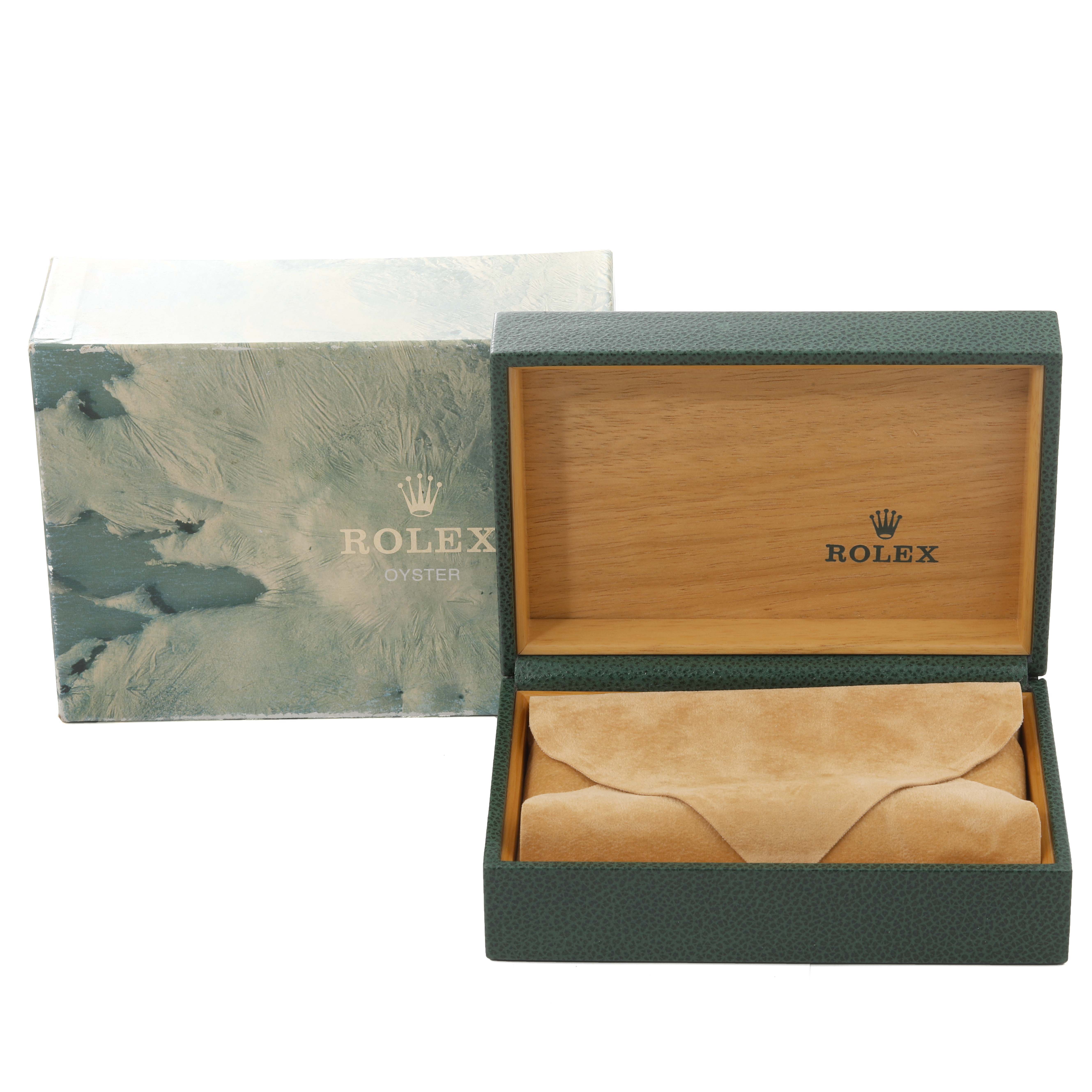 The image shows an open Rolex Datejust 16233 Men's Steel and Gold (two tone) Champagne Dial 16233 Men's Steel and Gold (two tone) Champagne Dial box with a green exterior, wooden interior, and a beige suede watch pouch inside.