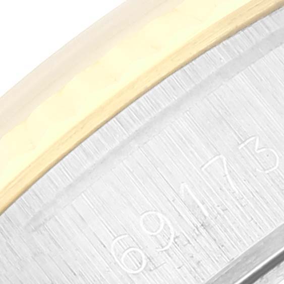This image shows a close-up of the model number inscription on the case bezel of a Rolex Datejust 69173 Women's Steel and Gold (two tone) Champagne Dial 69173 Women's Steel and Gold (two tone) Champagne Dial watch.