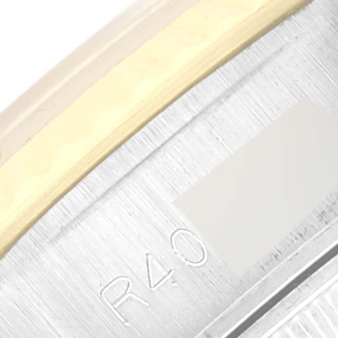 The image shows a close-up of the side of the casing of a Rolex Datejust 69173 Women's Steel and Gold (two tone) Champagne Dial 69173 Women's Steel and Gold (two tone) Champagne Dial watch, revealing the bezel and part of the serial number.
