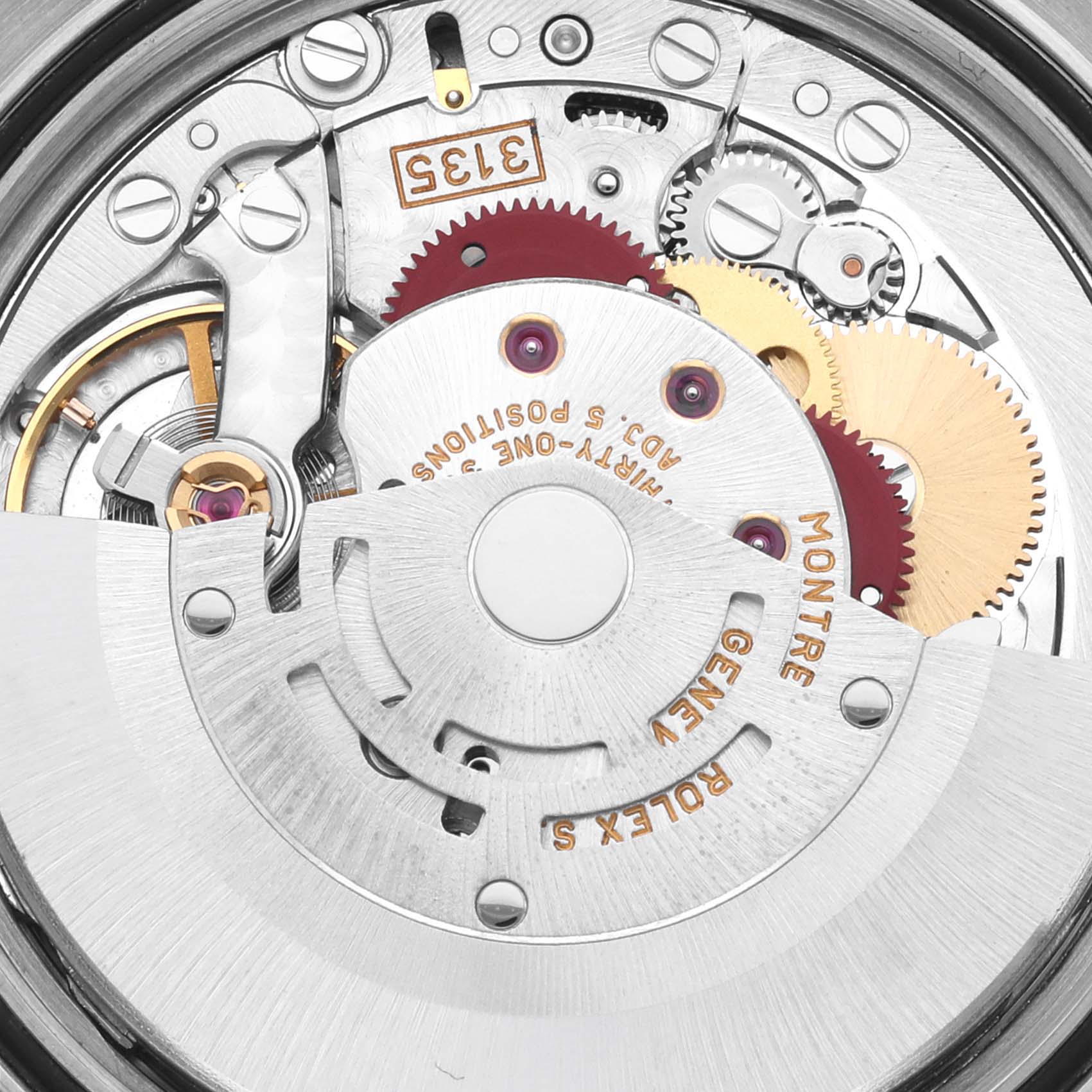 The image shows the intricate inner mechanisms of a Rolex Datejust 16233 Men's Steel and Gold (two tone) Champagne Dial 16233 Men's Steel and Gold (two tone) Champagne Dial watch, focusing on gears and the rotor.
